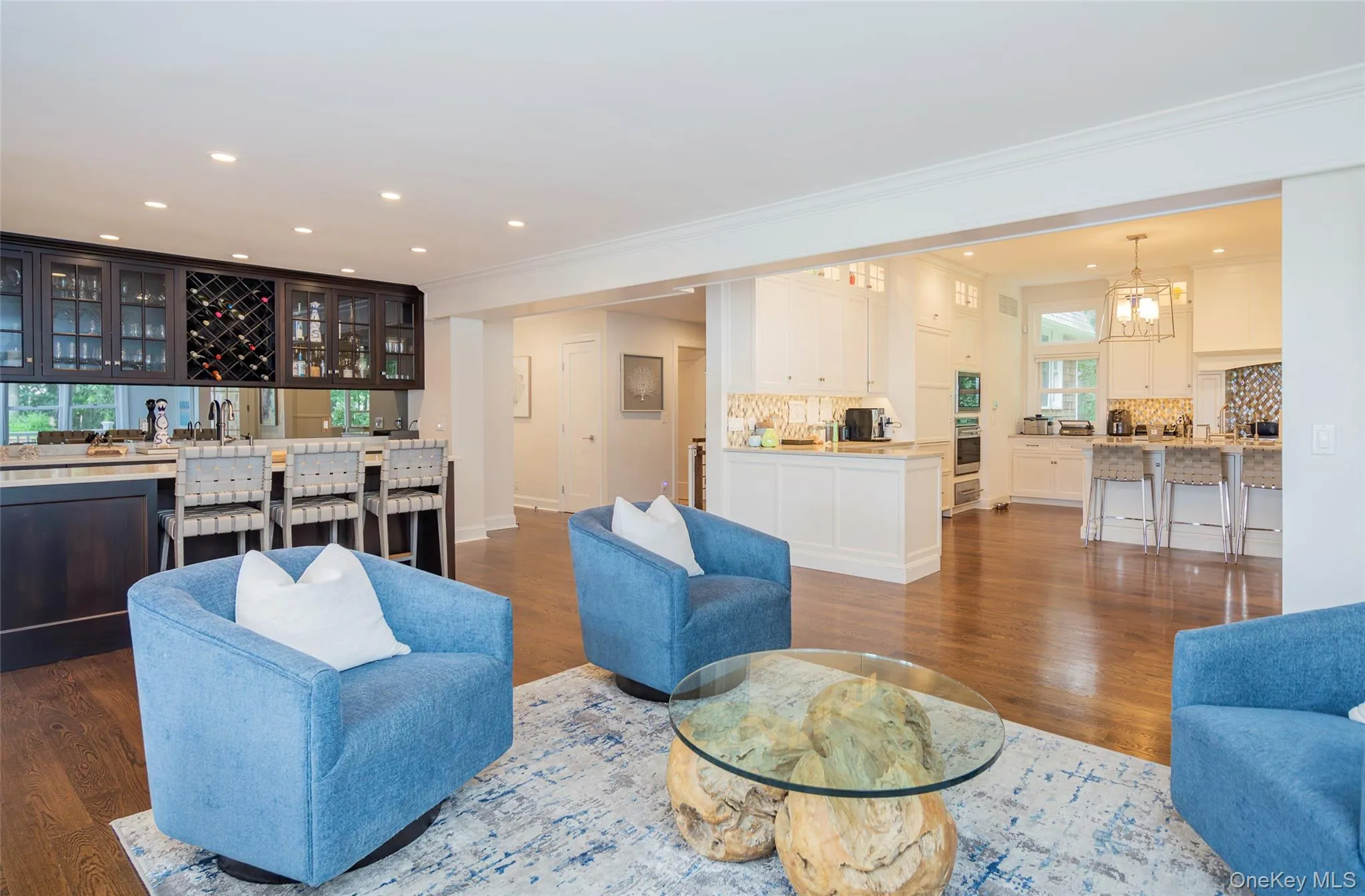 Open concept living space featuring wood-finish flooring Open concept living space featuring wood-finish flooring