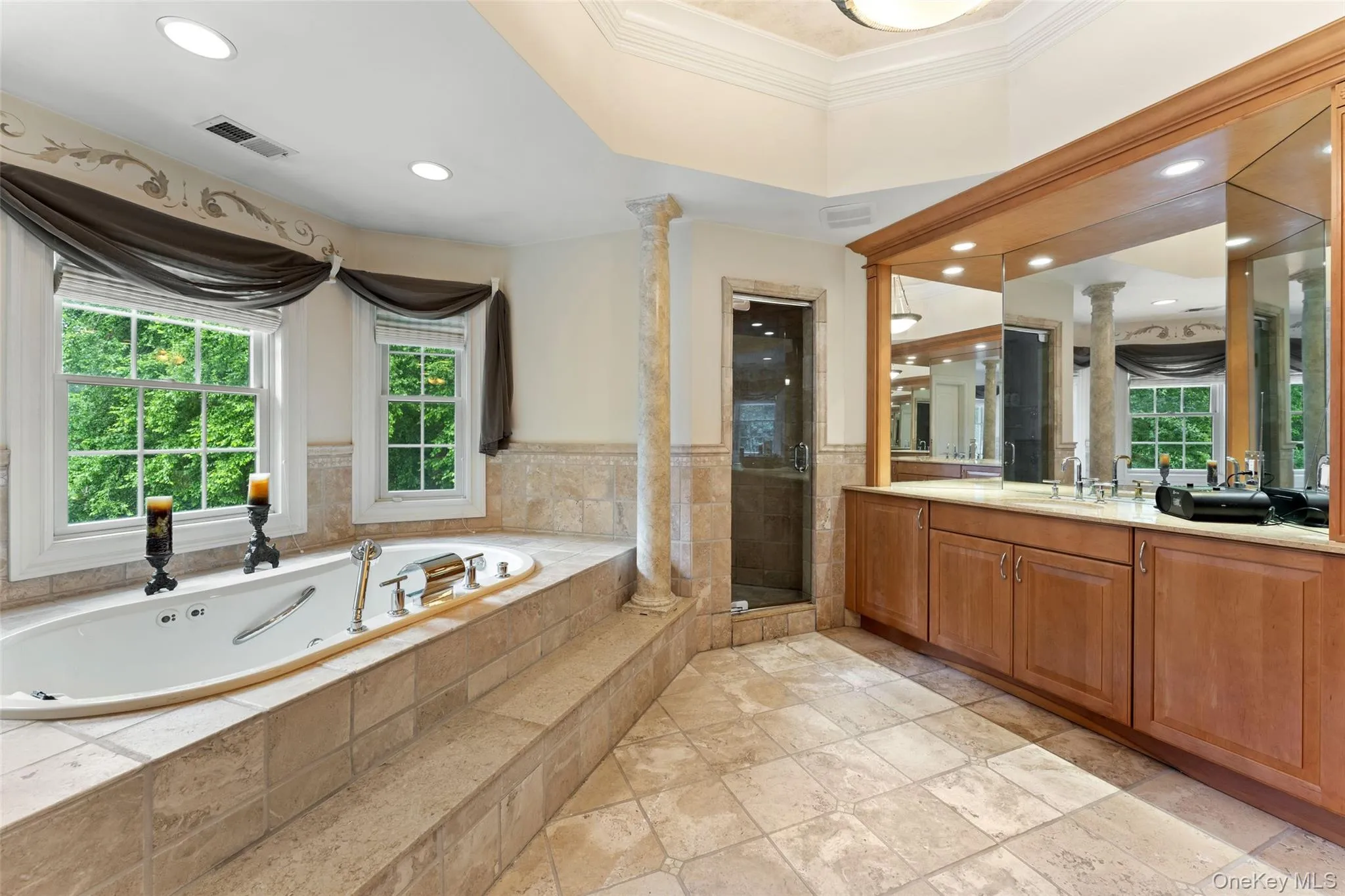 Primary Suite Bath offering double sinks, soaking tub and shower. Primary Suite Bath offering double sinks, soaking tub and shower.