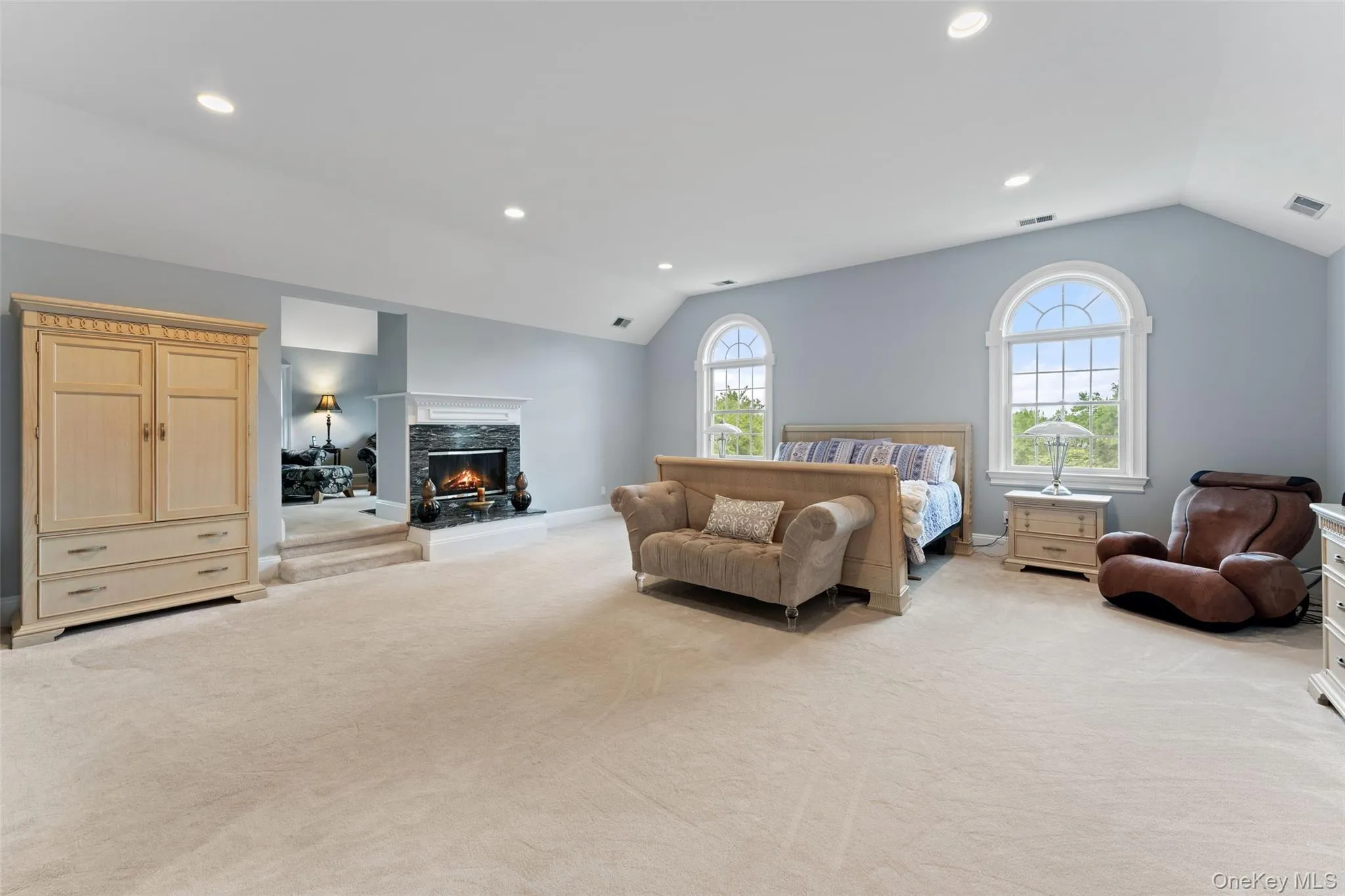 Primary Bedroom en-suite with fireplace featuring Sitting Room, 2 walk-in closets and sauna. Primary Bedroom en-suite with fireplace featuring Sitting Room, 2 walk-in closets and sauna.