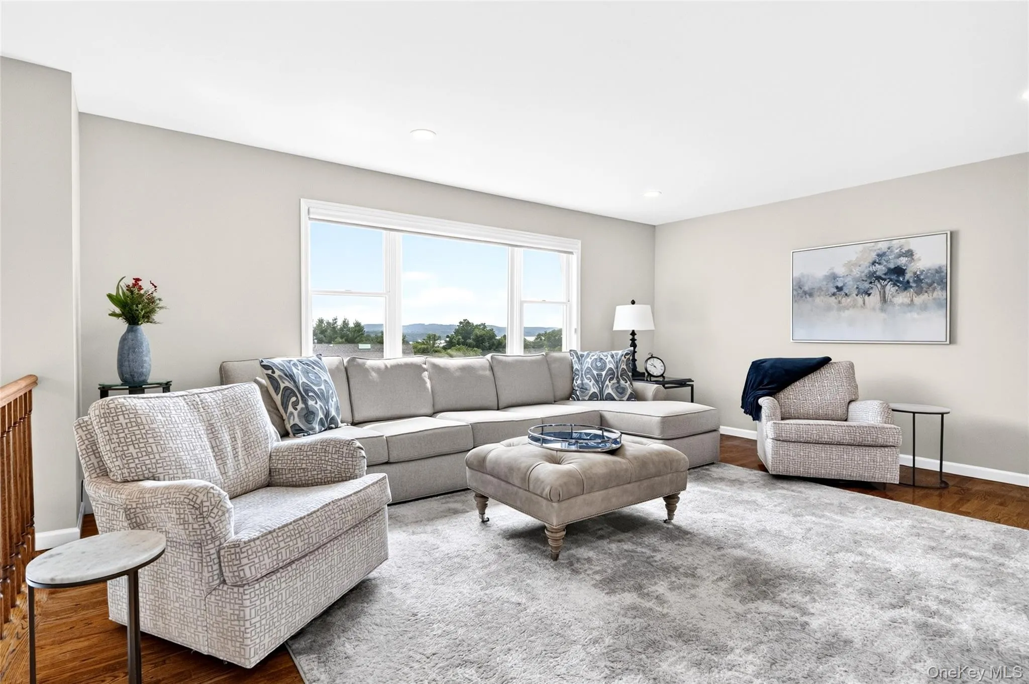 Living room with lots of natural light & stunning river views Living room with lots of natural light & stunning river views