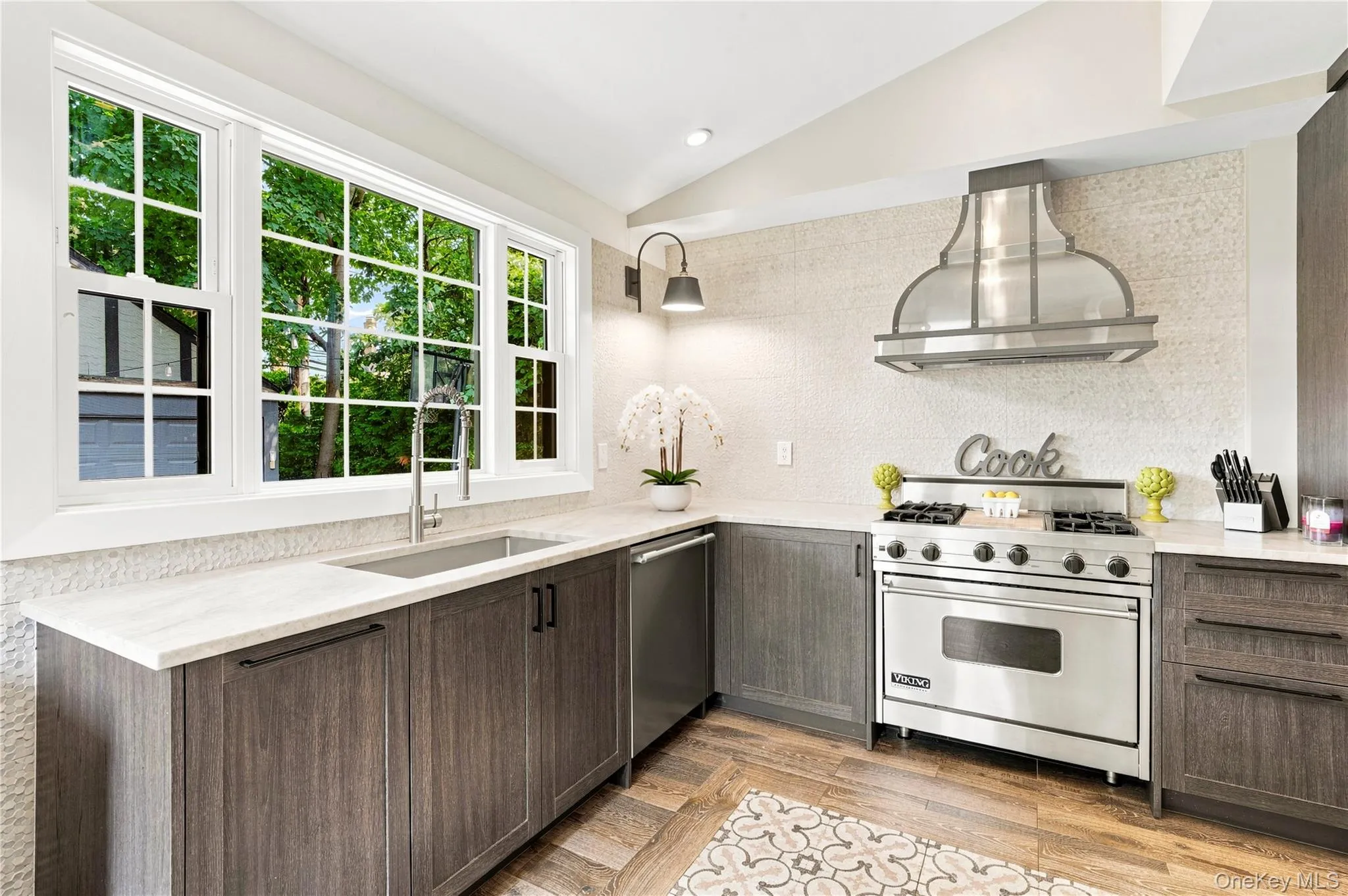 Newly Renovated Kitchen with high end appliances and porcelanosa cabinetry and flooring Newly Renovated Kitchen with high end appliances and porcelanosa cabinetry and flooring