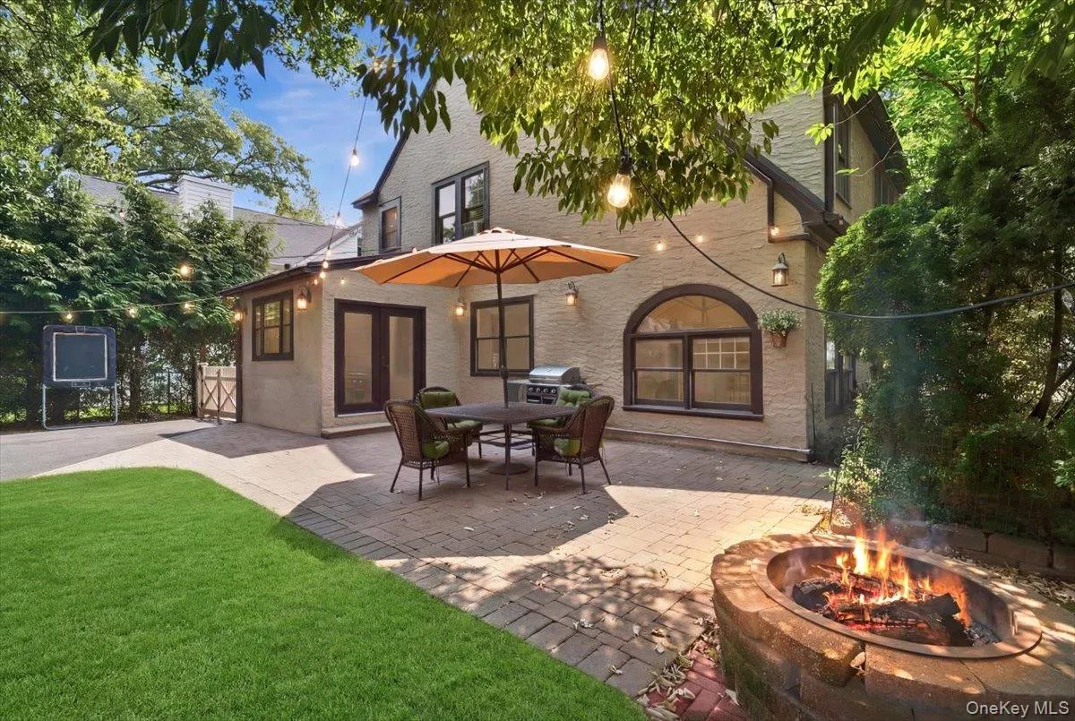 Enjoy seamless indoor-outdoor living with an expansive patio just off the kitchen, ideal for summer entertaining. Enjoy seamless indoor-outdoor living with an expansive patio just off the kitchen, ideal for summer entertaining.