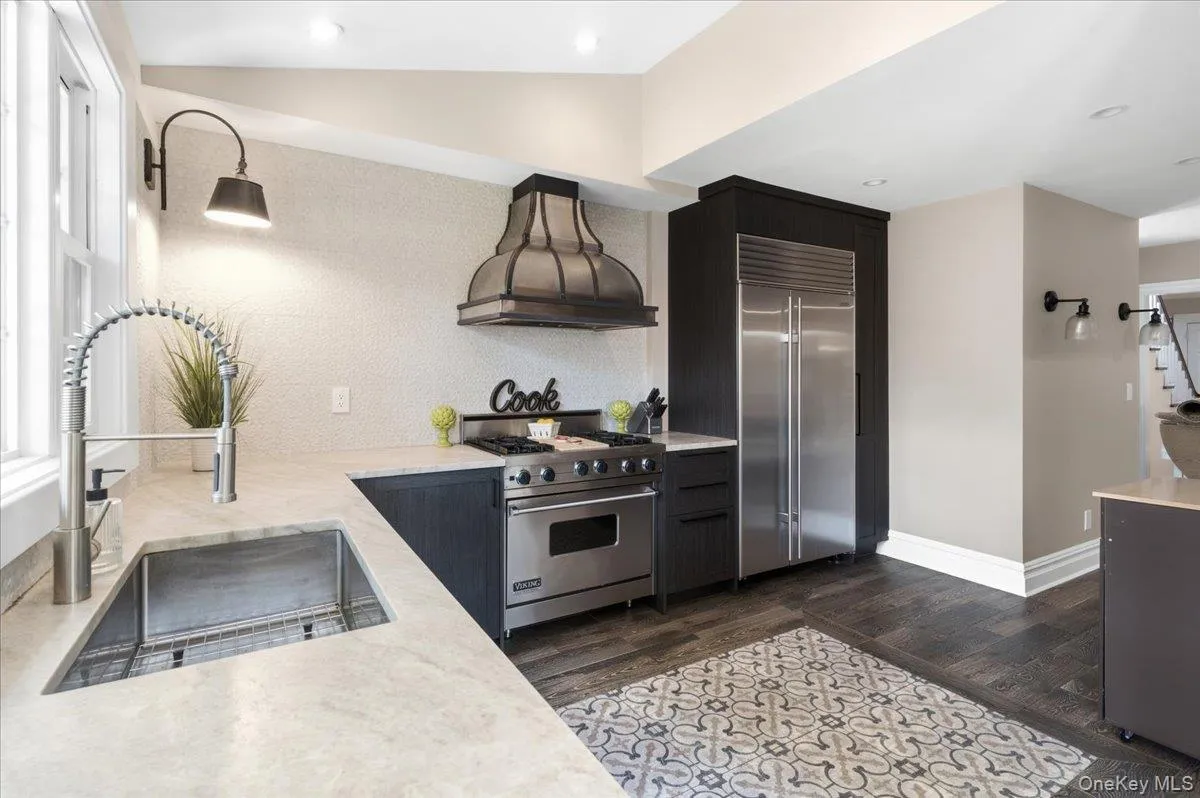 Newly Renovated Kitchen with high end appliances and porcelanosa cabinetry and flooring Newly Renovated Kitchen with high end appliances and porcelanosa cabinetry and flooring