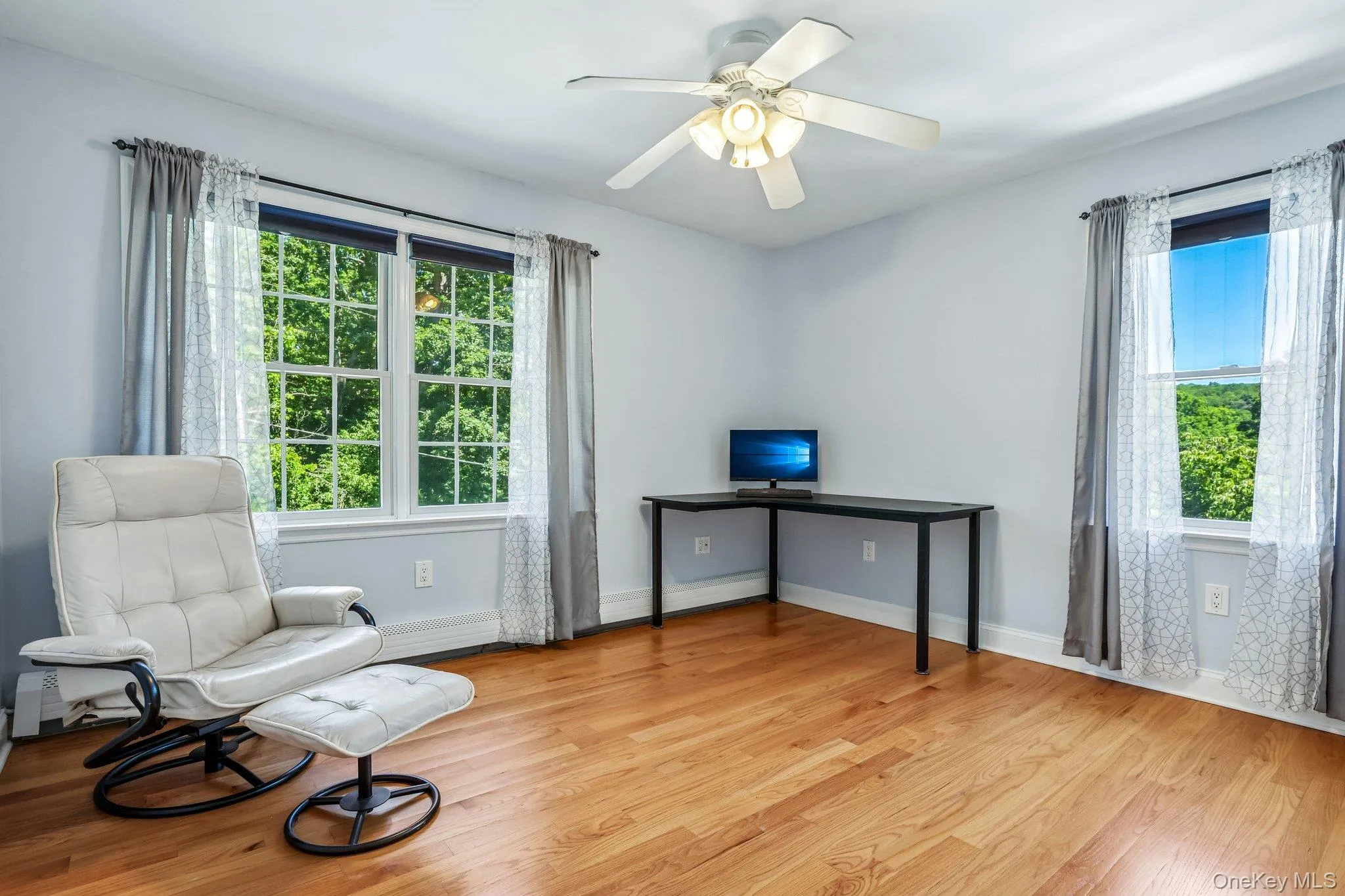 Nice size bedroom with hardwood floors Nice size bedroom with hardwood floors