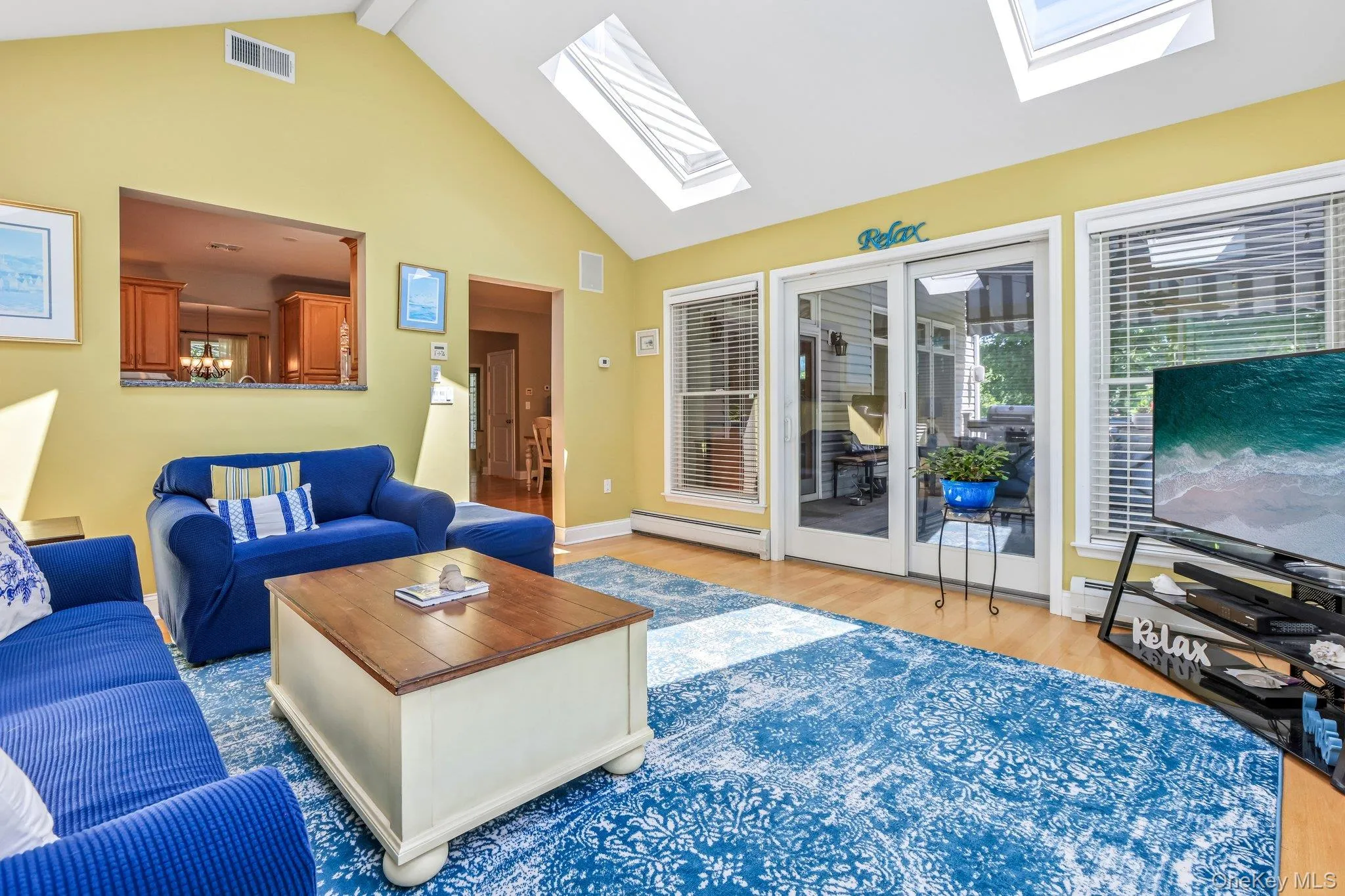 Sunroom offers vaulted ceiling with skylights Sunroom offers vaulted ceiling with skylights