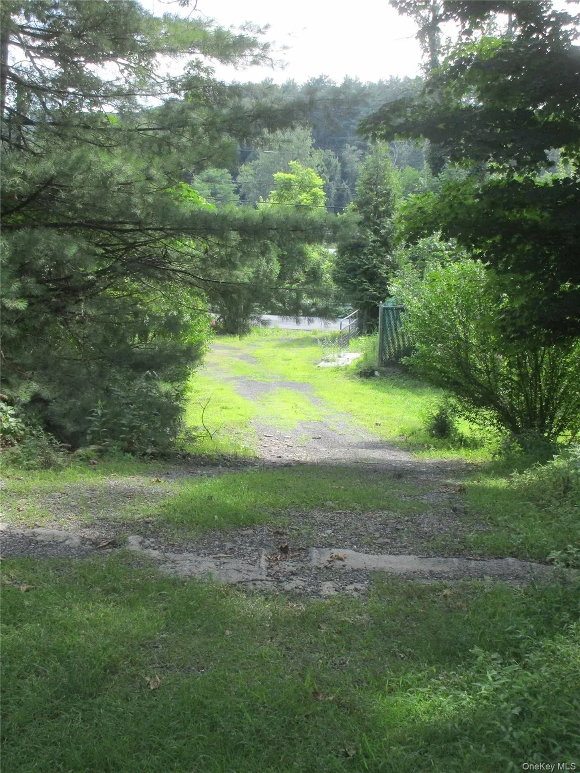 Gated Road leading up to upper field with pole barn Gated Road leading up to upper field with pole barn