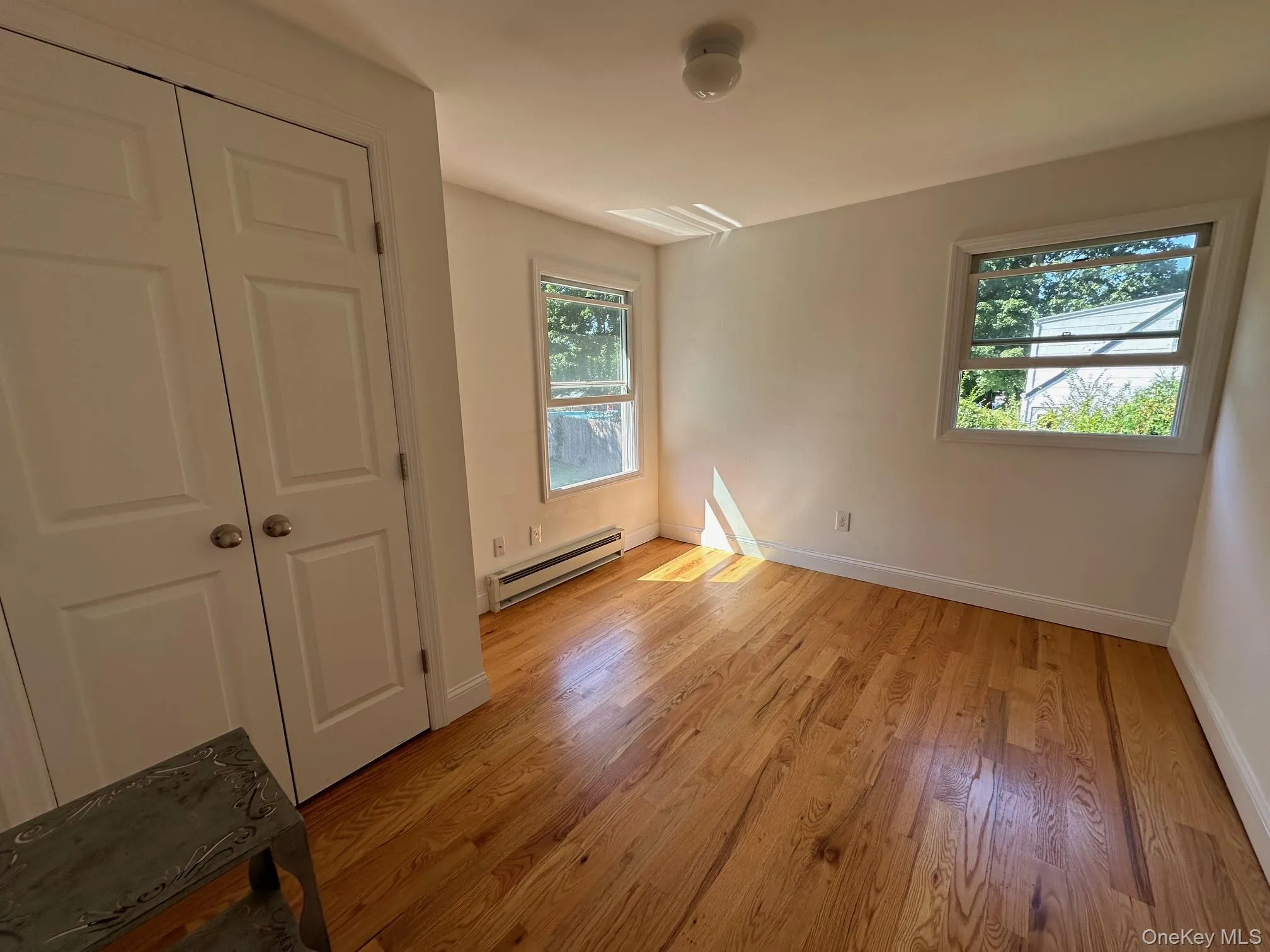 Bedroom #2 with wood floors Bedroom #2 with wood floors
