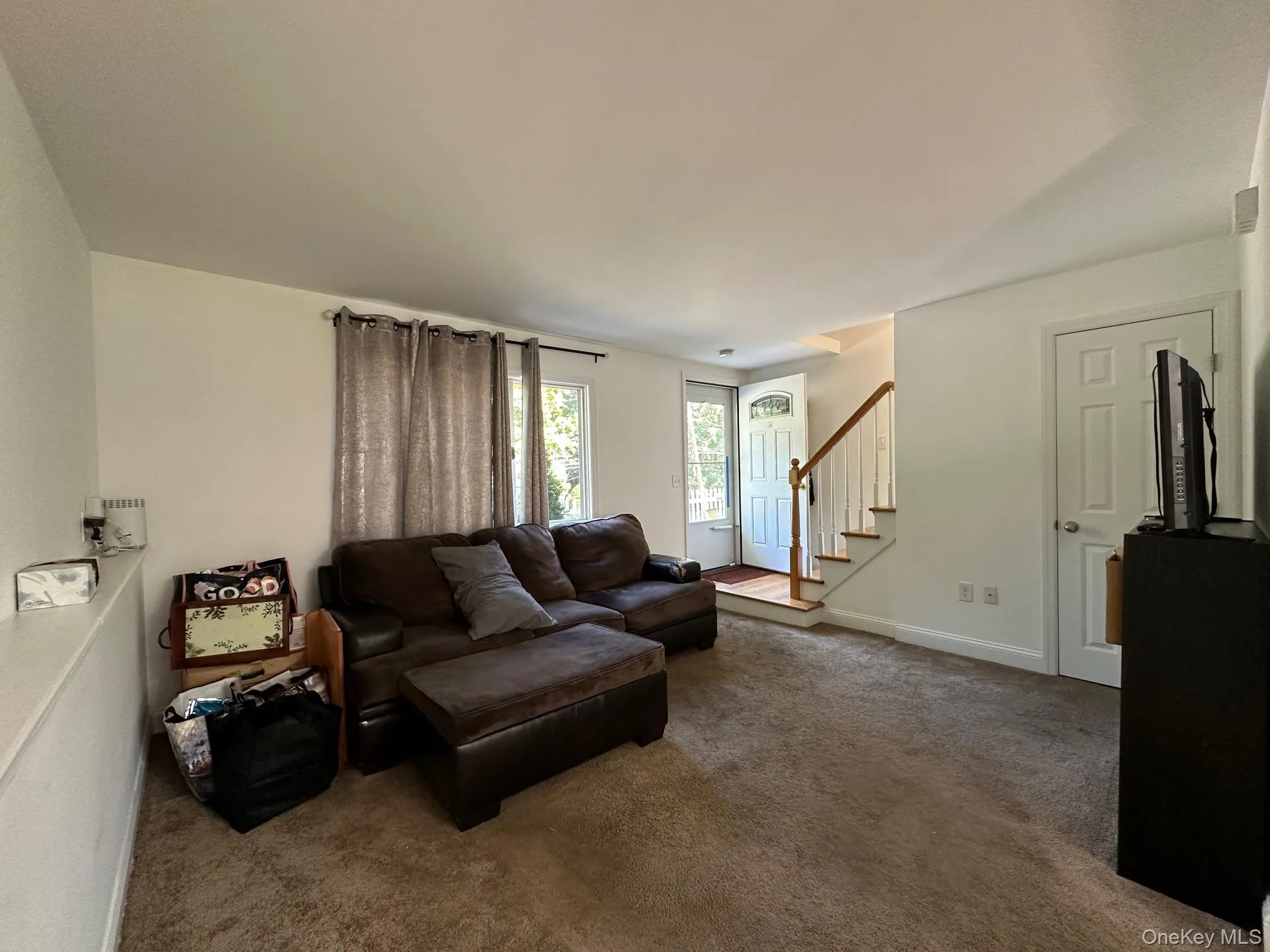 Living room with carpet floors Living room with carpet floors