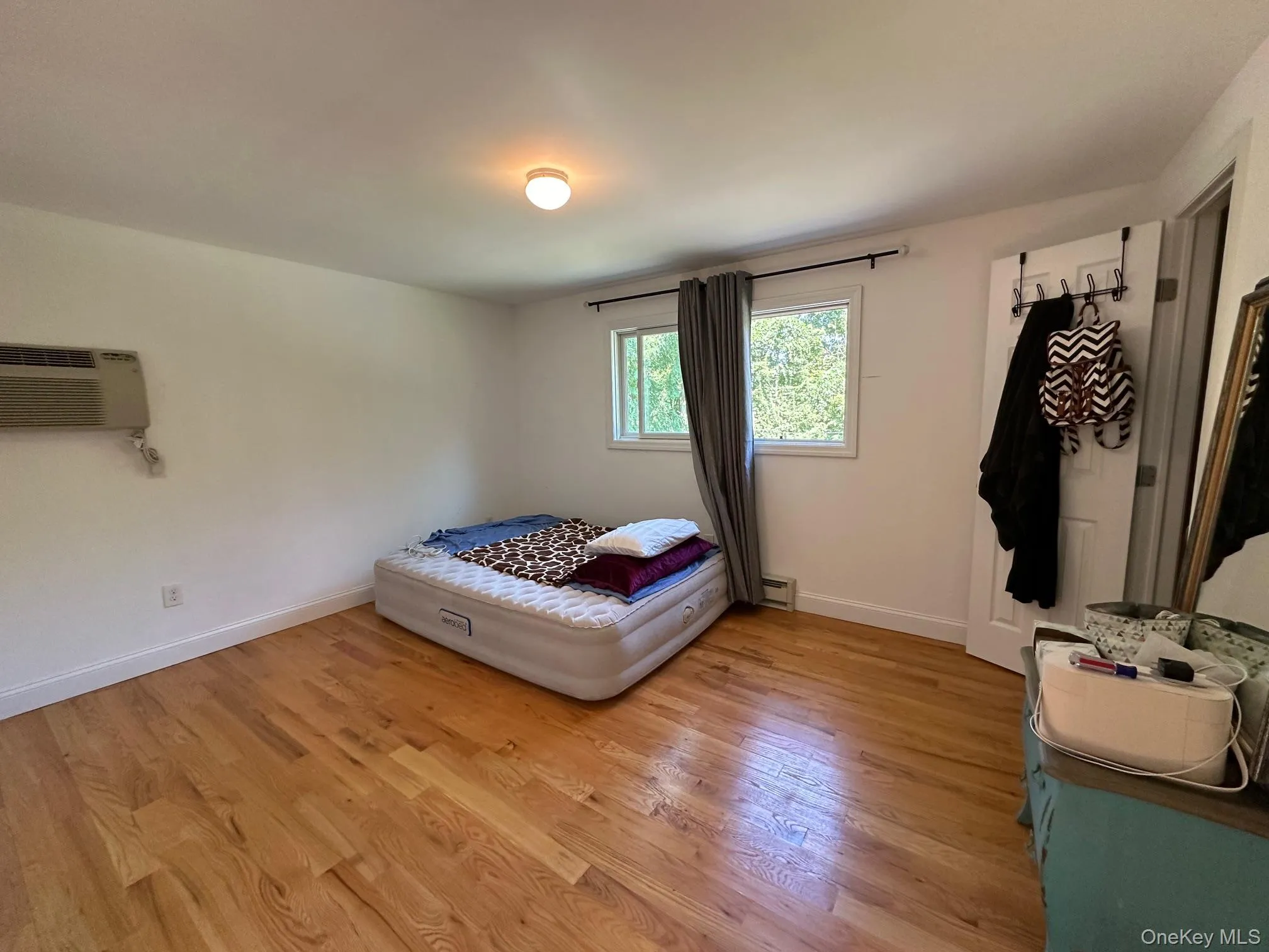 Bedroom #1 with wood floors Bedroom #1 with wood floors