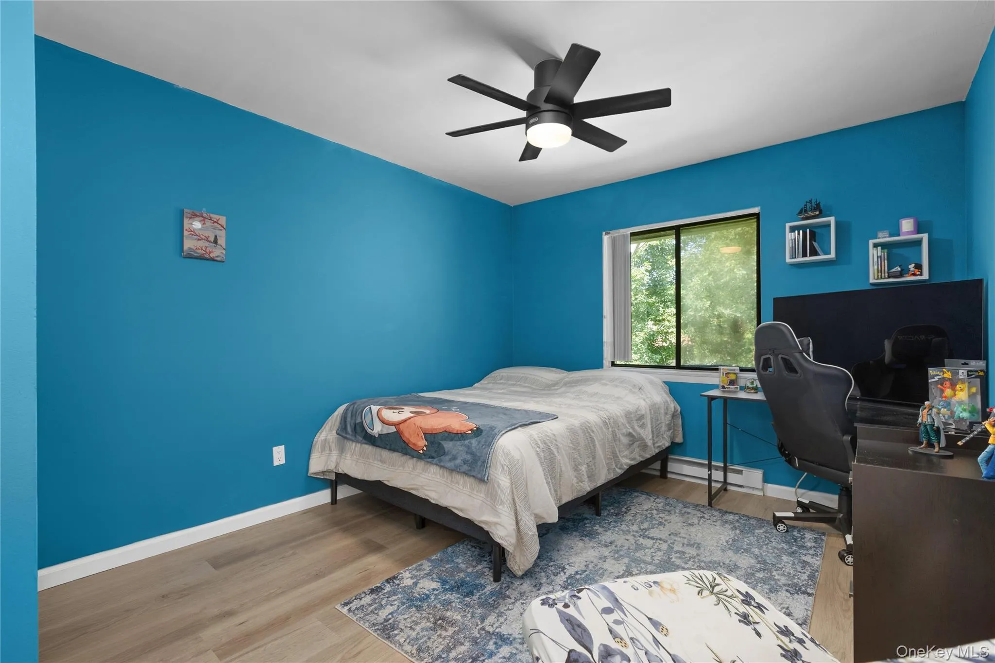 Third bedroom featuring vinyl flooring, ceiling fan, and built in closet Third bedroom featuring vinyl flooring, ceiling fan, and built in closet