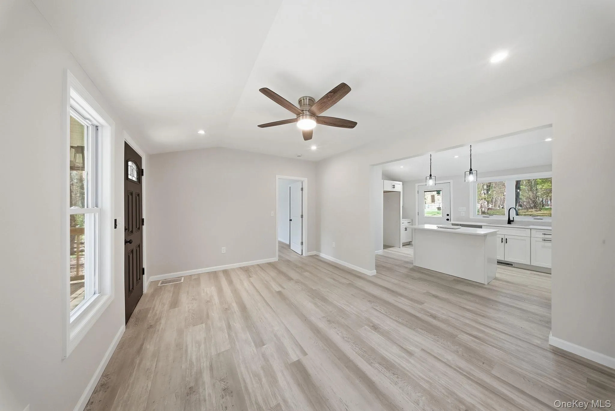Open concept living area featuring recessed lighting, and a ceiling fan Open concept living area featuring recessed lighting, and a ceiling fan