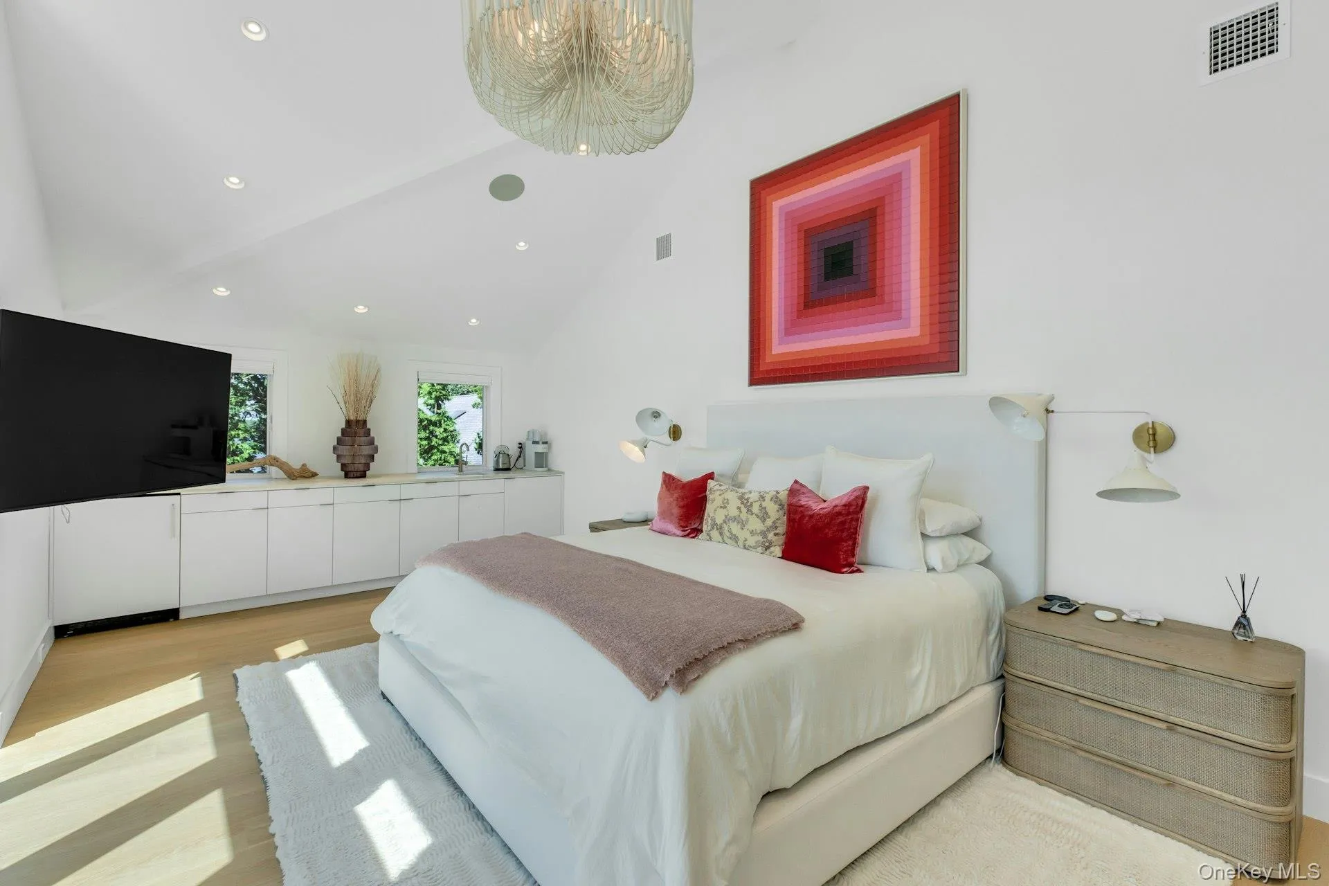 Primary Bedroom with Vaulted ceiling with recessed lighting and contemporary chandelier Primary Bedroom with Vaulted ceiling with recessed lighting and contemporary chandelier