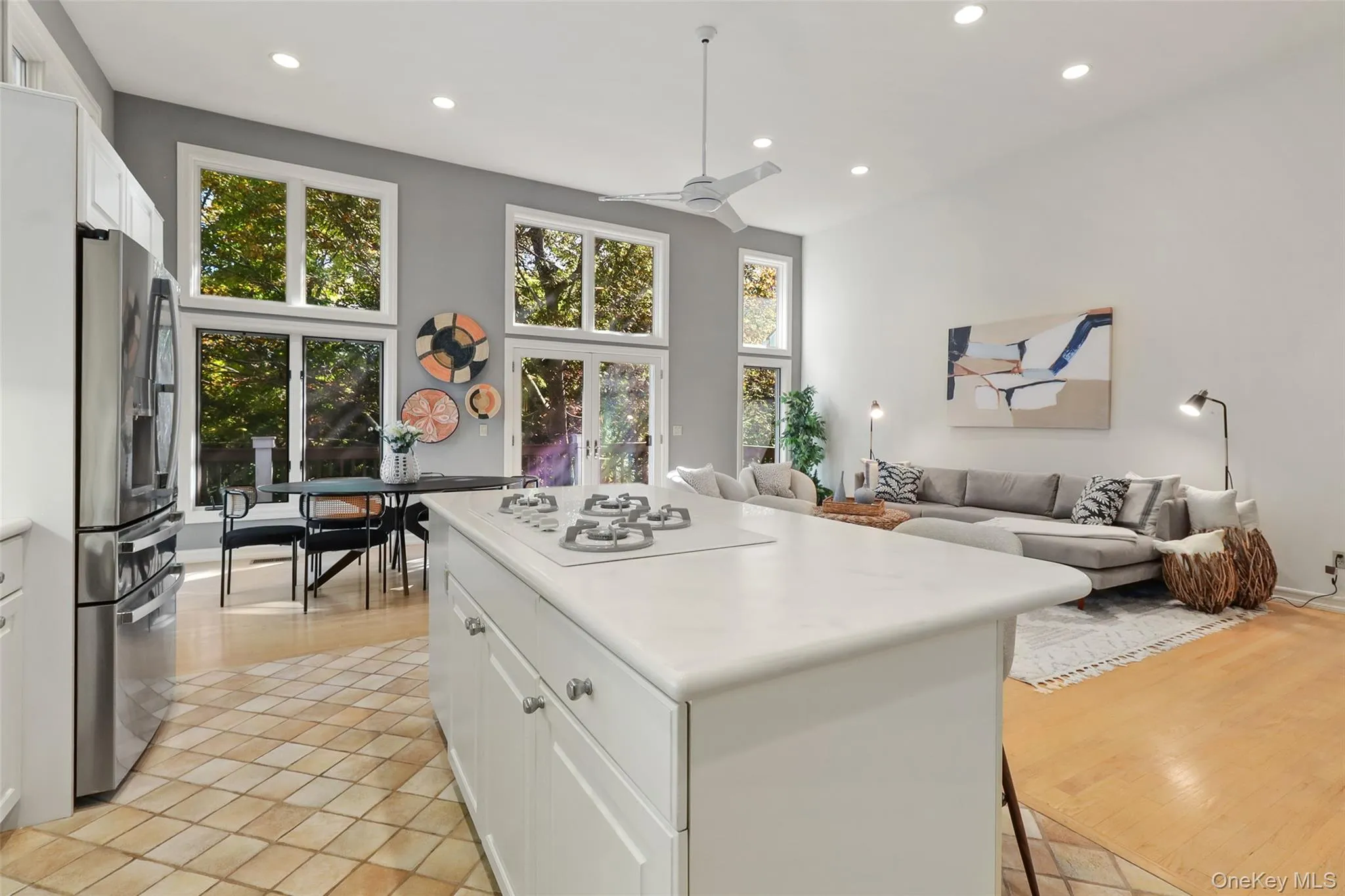 Kitchen, eat in kitchen, and family room with high ceilings and floor to ceiling windows Kitchen, eat in kitchen, and family room with high ceilings and floor to ceiling windows
