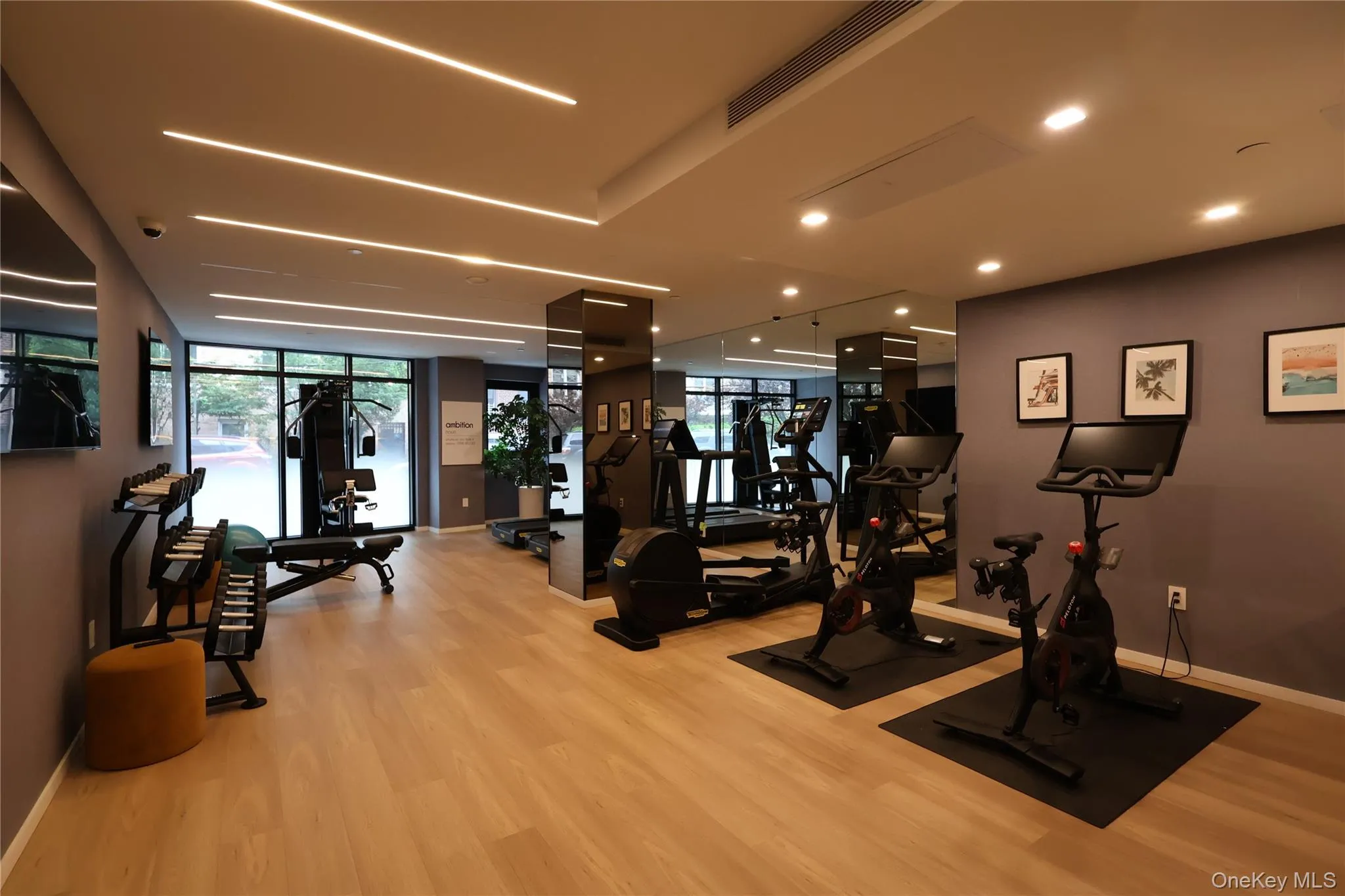 Exercise room with baseboards and wood finished floors Exercise room with baseboards and wood finished floors