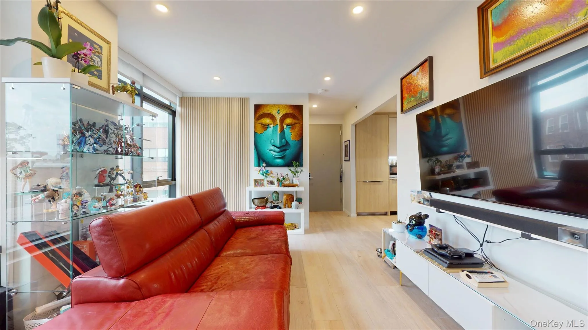Living area featuring wood finished floors and recessed lighting Living area featuring wood finished floors and recessed lighting
