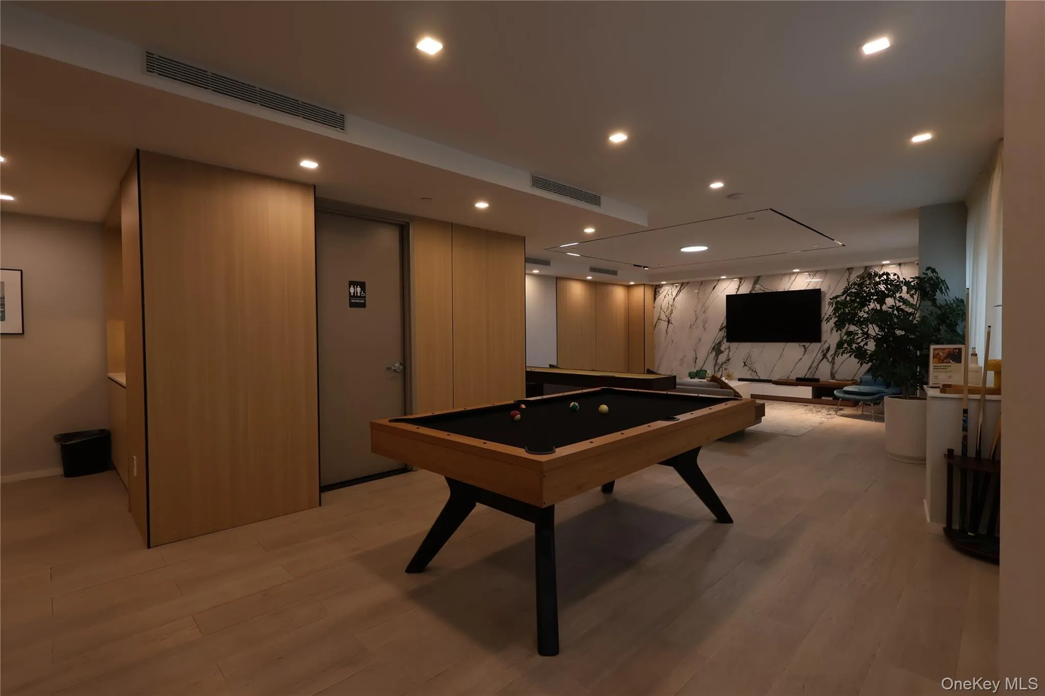Recreation room with billiards, light wood-style floors, and recessed lighting Recreation room with billiards, light wood-style floors, and recessed lighting