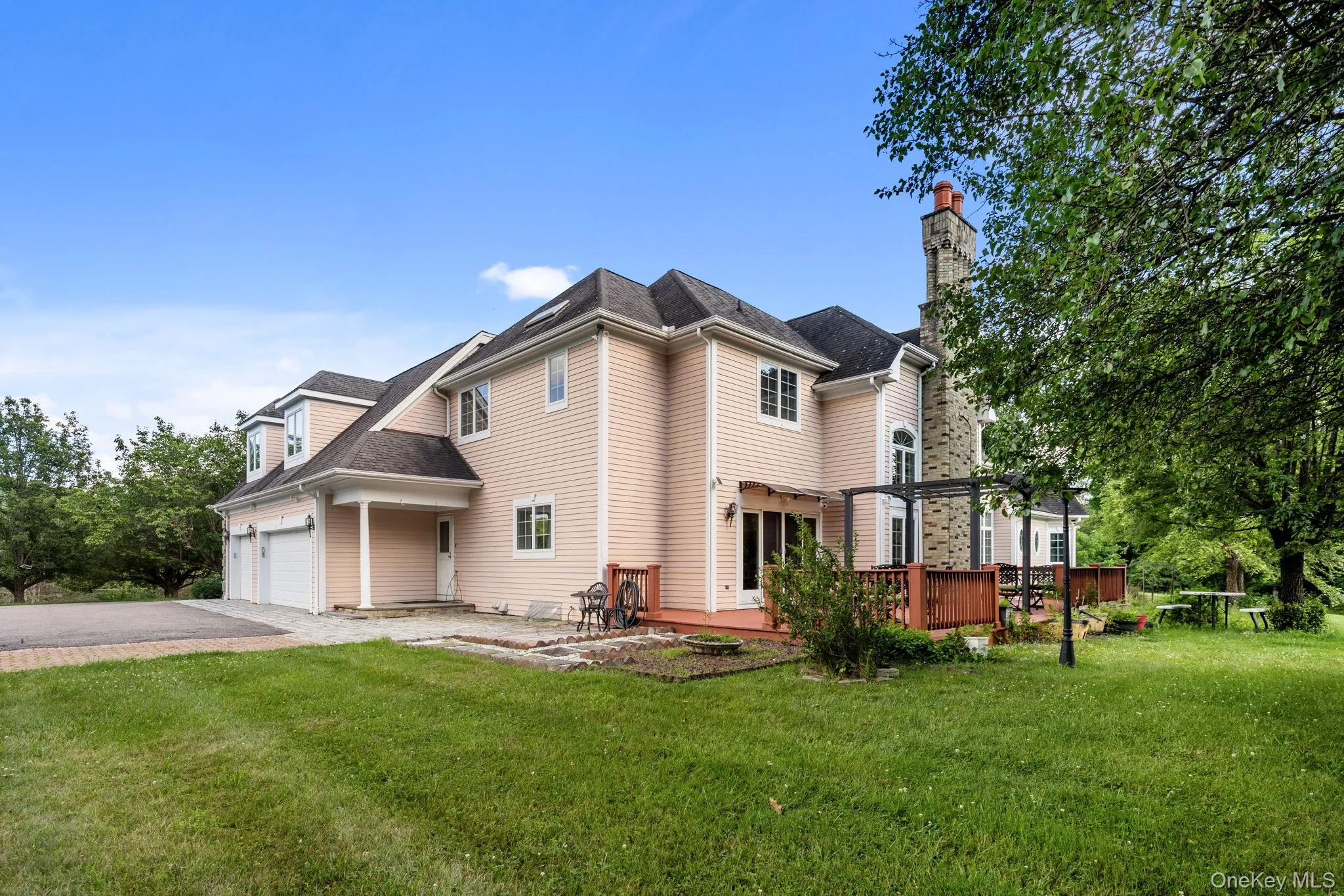 The spacious deck and oversized three-car garage enhance the home’s exceptional outdoor living and storage capabilities. The spacious deck and oversized three-car garage enhance the home’s exceptional outdoor living and storage capabilities.