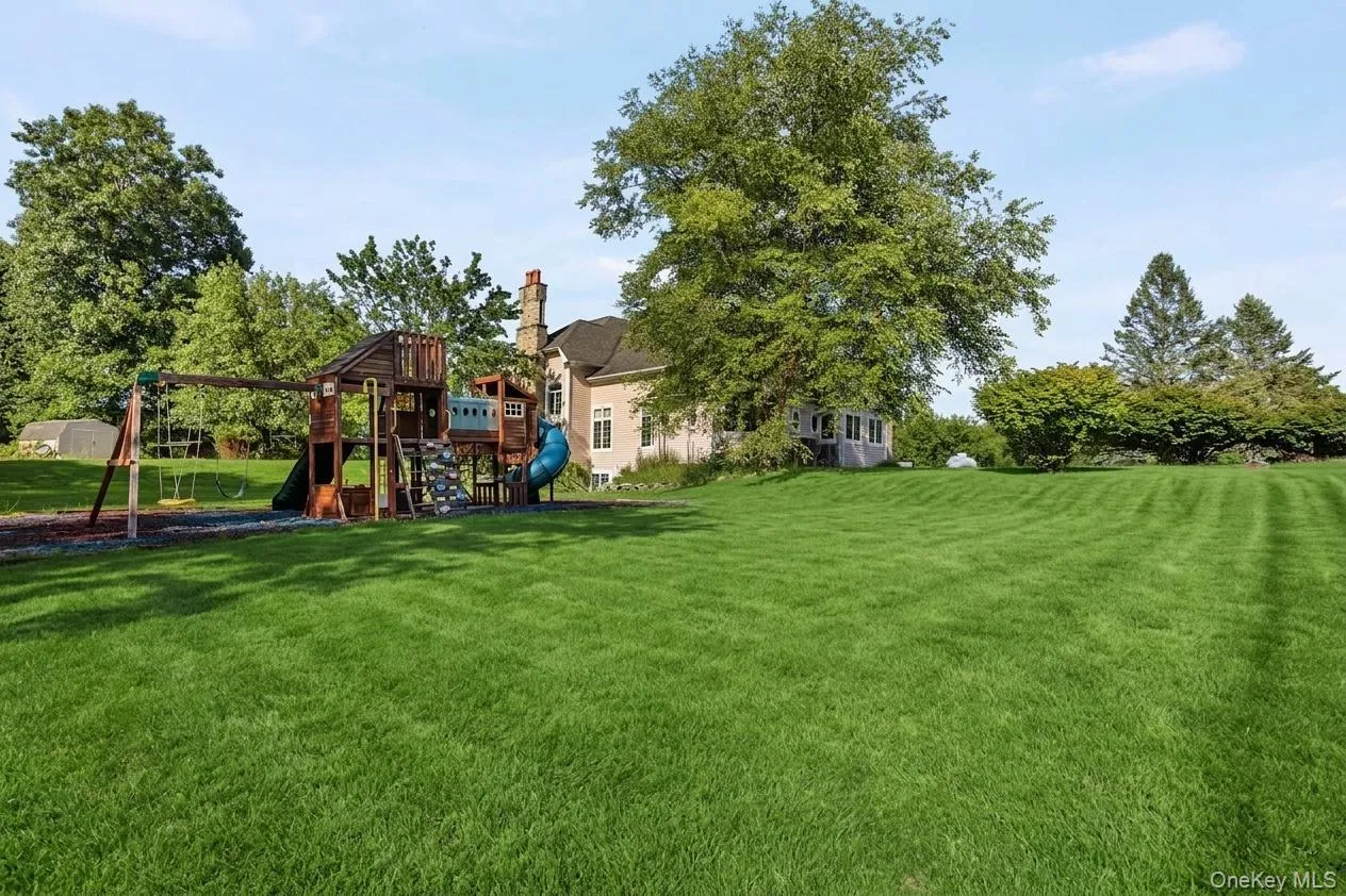 A generous level lawn with a dedicated play area enhances the property’s exceptional outdoor appeal. A generous level lawn with a dedicated play area enhances the property’s exceptional outdoor appeal.