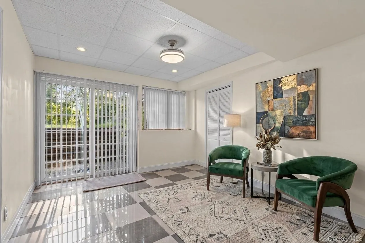 Located on the lower level, a charming sitting area welcomes you in from the backyard, creating a cozy transition between indoor and outdoor living. Located on the lower level, a charming sitting area welcomes you in from the backyard, creating a cozy transition between indoor and outdoor living.