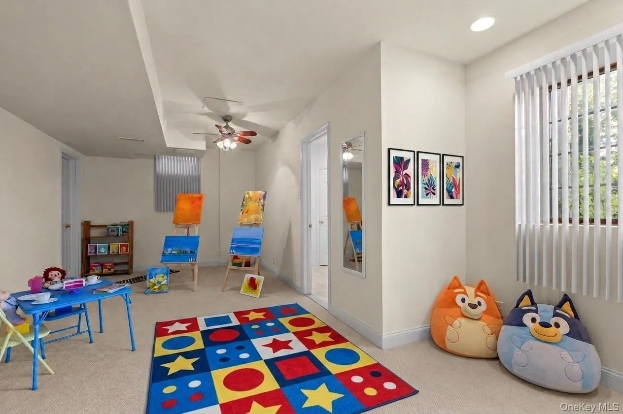Currently used as a playroom, this versatile lower-level space offers wall-to-wall carpeting, an expansive storage closet, and endless possibilities for recreation, hobbies, or additional living space. Currently used as a playroom, this versatile lower-level space offers wall-to-wall carpeting, an expansive storage closet, and endless possibilities for recreation, hobbies, or additional living space.