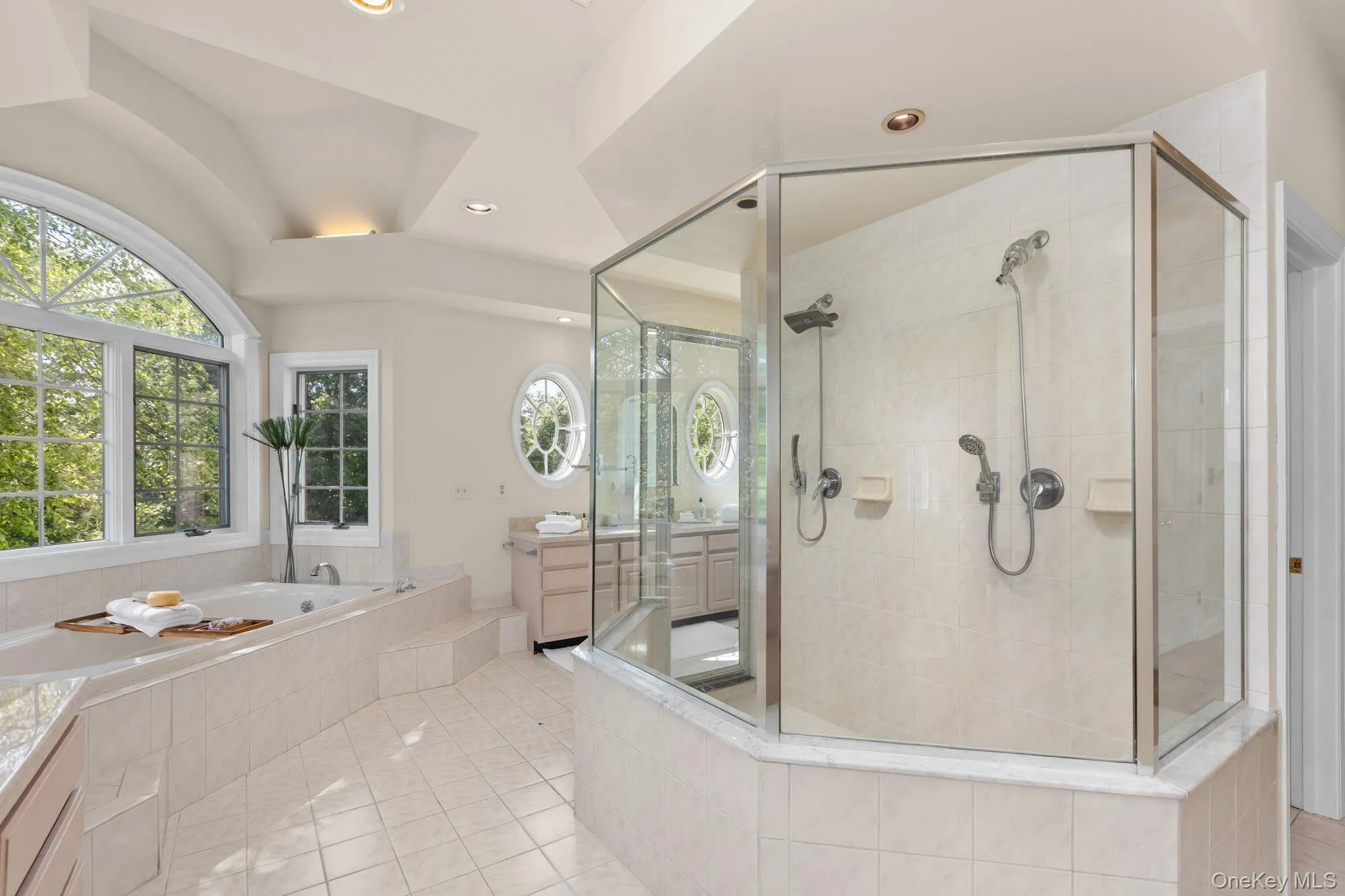 Designed for modern luxury, this primary bathroom includes a spacious glass shower and beautifully appointed details. Designed for modern luxury, this primary bathroom includes a spacious glass shower and beautifully appointed details.