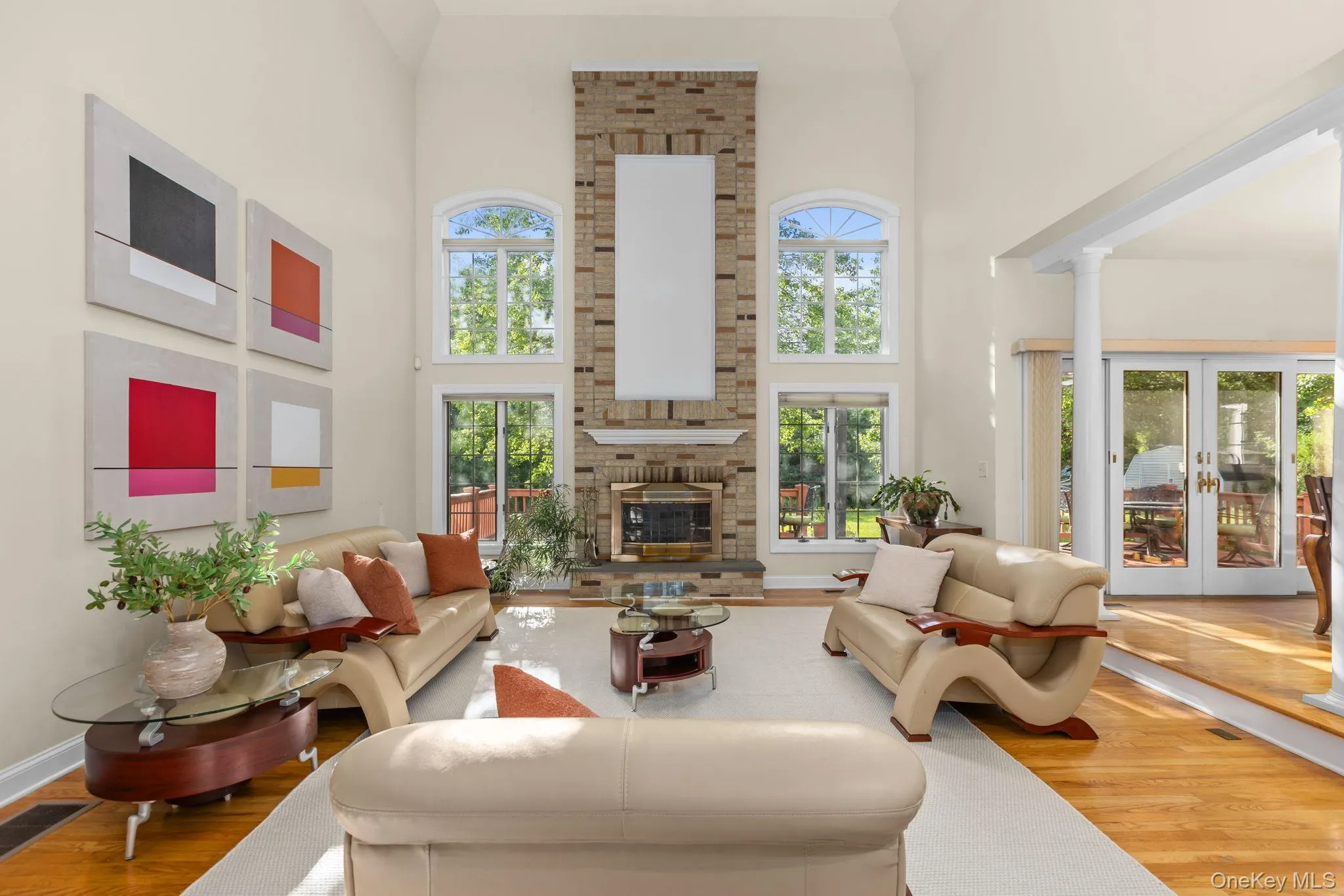 Vaulted ceilings, walls of windows, and a floor-to-ceiling brick fireplace define this spectacular family room. Vaulted ceilings, walls of windows, and a floor-to-ceiling brick fireplace define this spectacular family room.