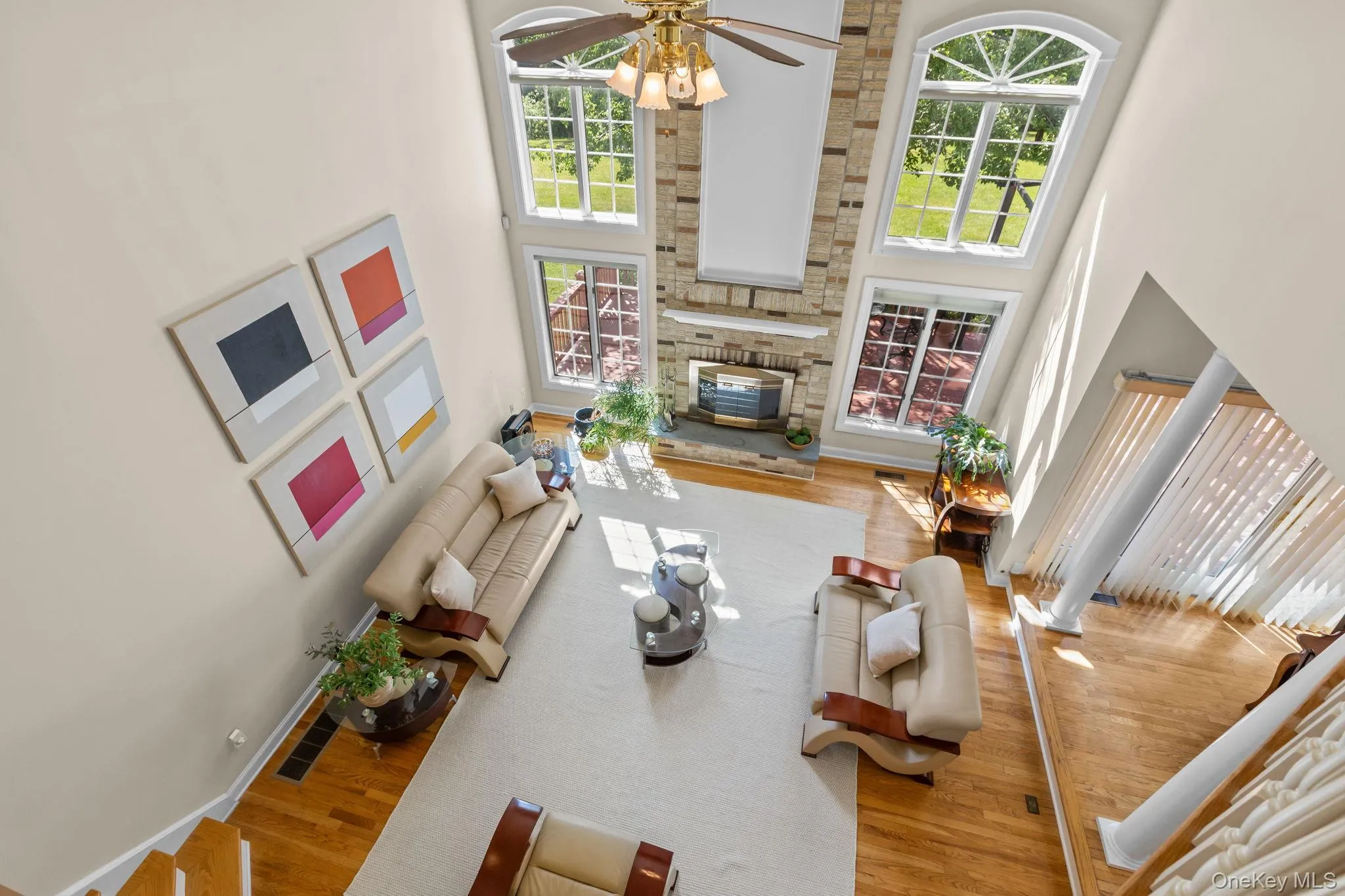 The upper-level balcony overlooks the expansive family room, enhancing the home's open, airy design. The upper-level balcony overlooks the expansive family room, enhancing the home's open, airy design.