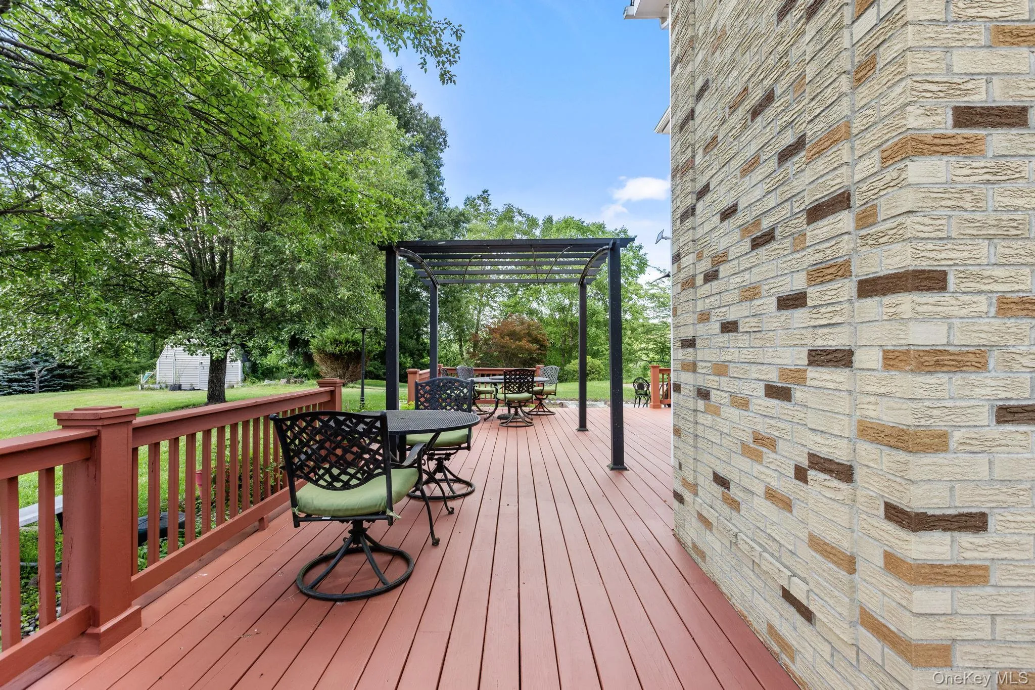 Freshly painted deck with a charming pergola, creating an inviting outdoor retreat for relaxing and entertaining. Freshly painted deck with a charming pergola, creating an inviting outdoor retreat for relaxing and entertaining.