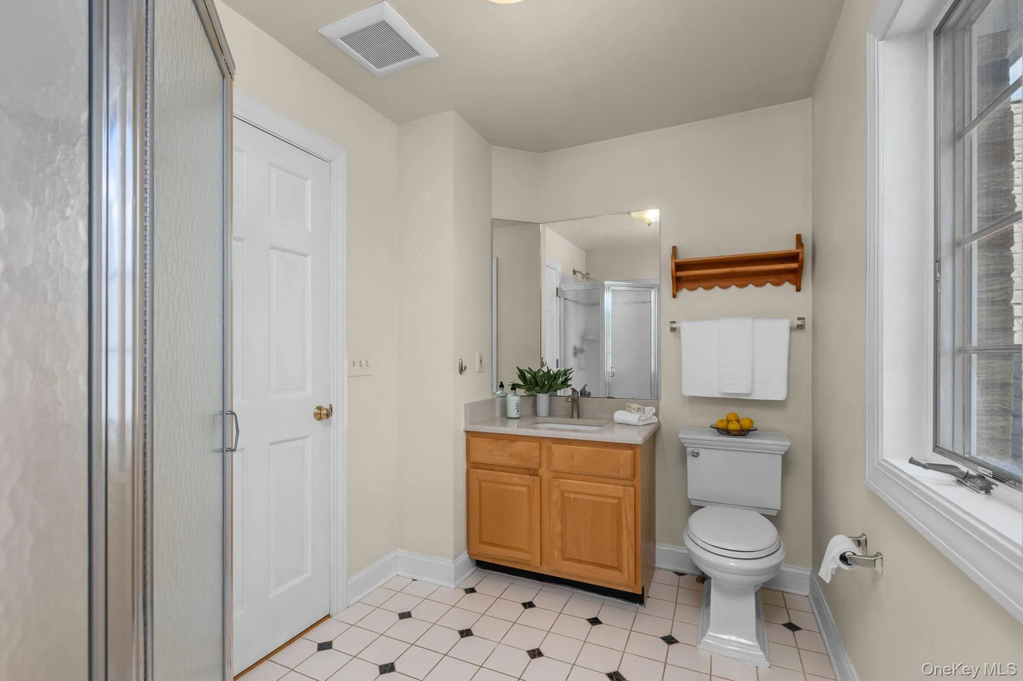 This thoughtfully positioned bathroom provides flexibility with access from the bedroom and hall. This thoughtfully positioned bathroom provides flexibility with access from the bedroom and hall.