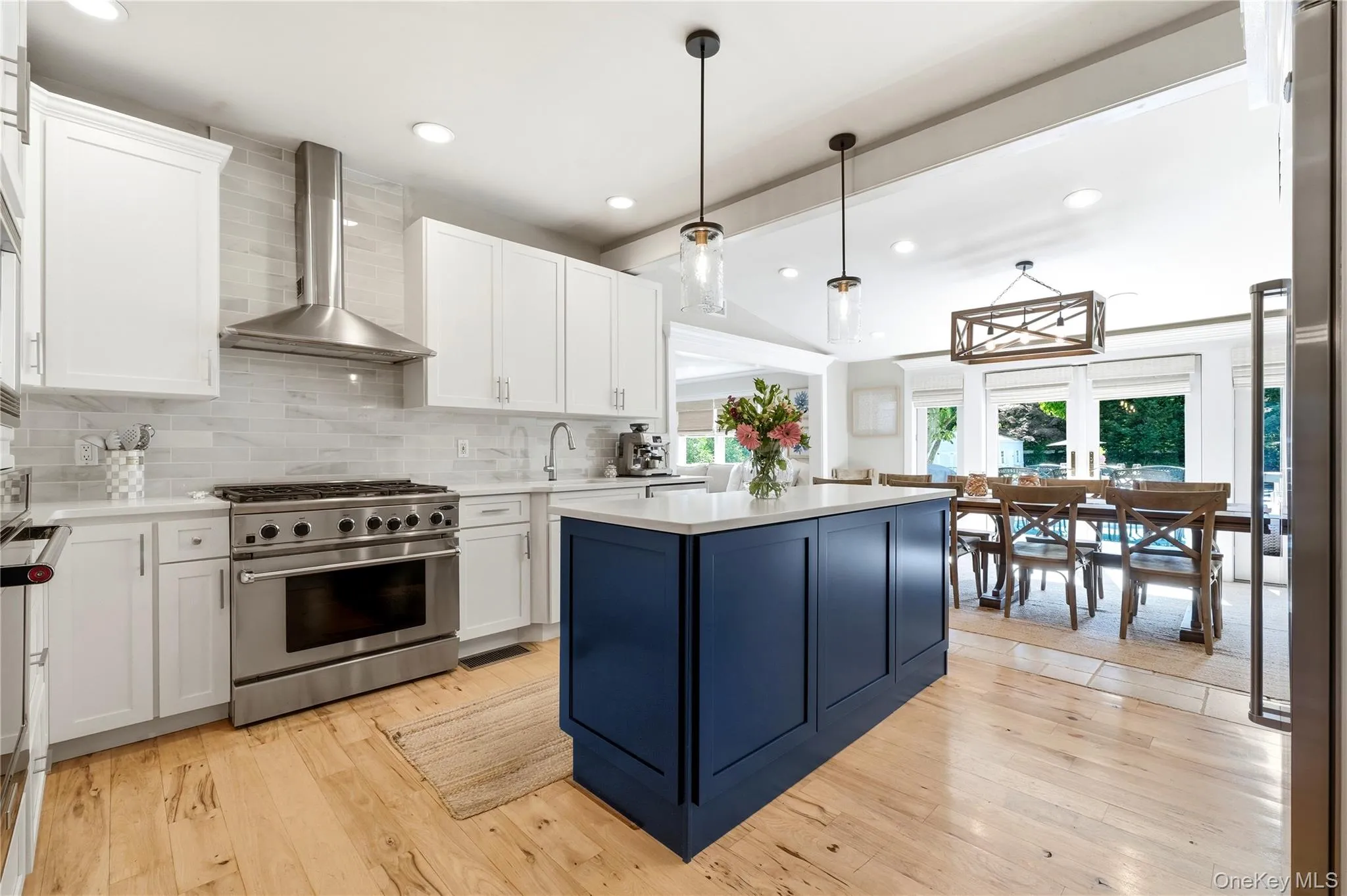 open concept, oversized island, wide plank hardwood floors open concept, oversized island, wide plank hardwood floors