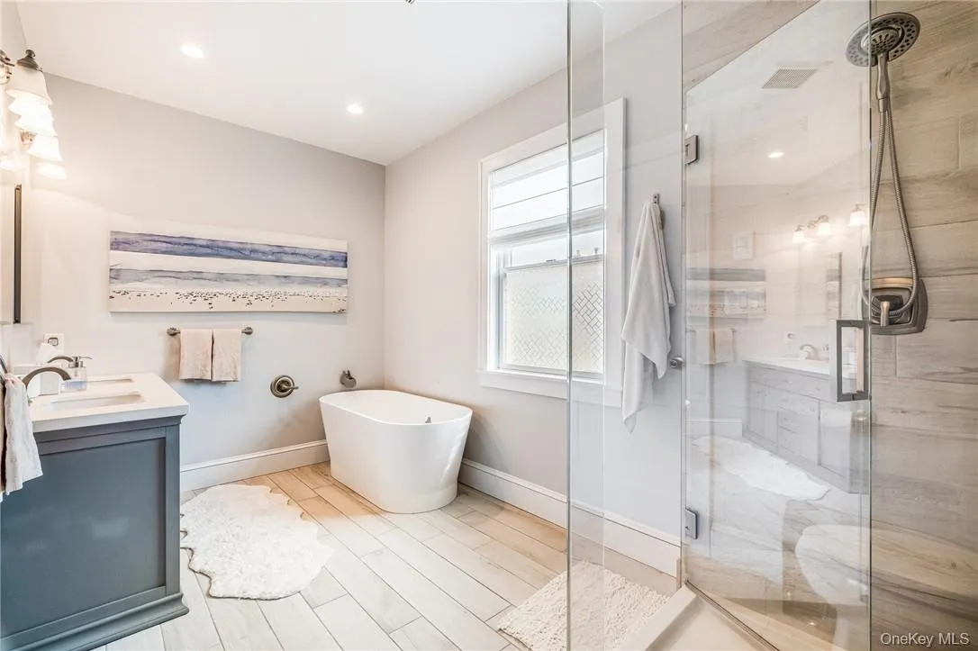 Primary Bathroom offers soaking tub, shower and radiant heated floor. Primary Bathroom offers soaking tub, shower and radiant heated floor.