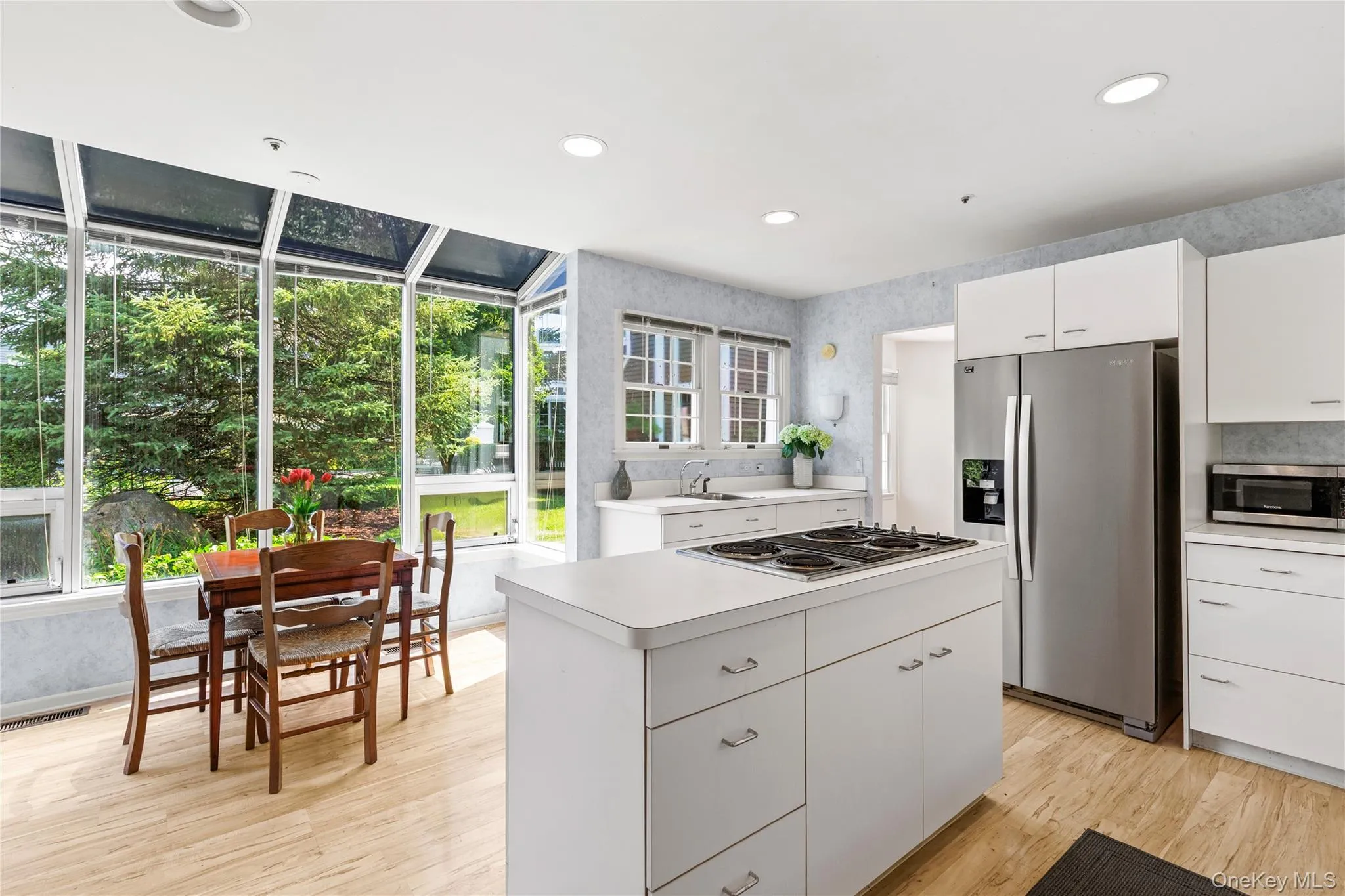 Sunny kitchen offers a window lined breakfast area Sunny kitchen offers a window lined breakfast area
