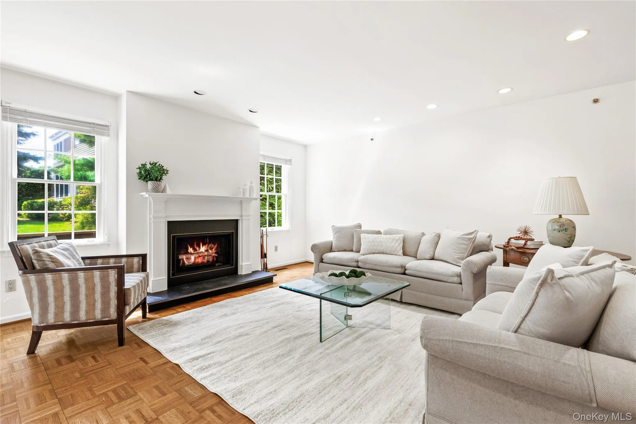 Spacious living room with wood burning fireplace Spacious living room with wood burning fireplace