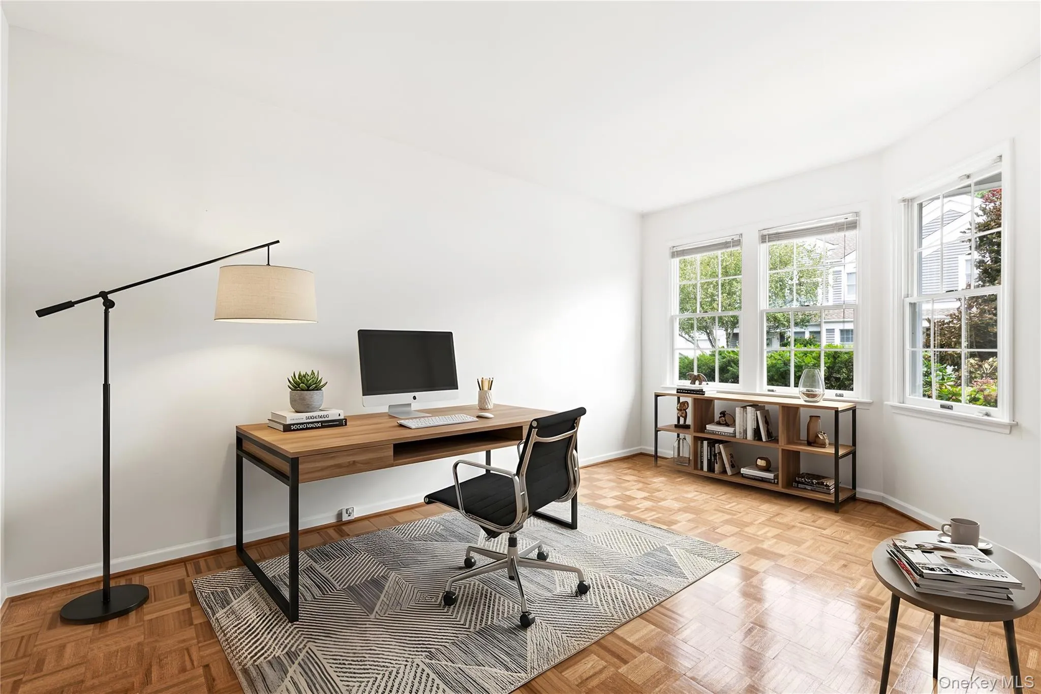 Virtually staged photo of the first floor room as an office Virtually staged photo of the first floor room as an office