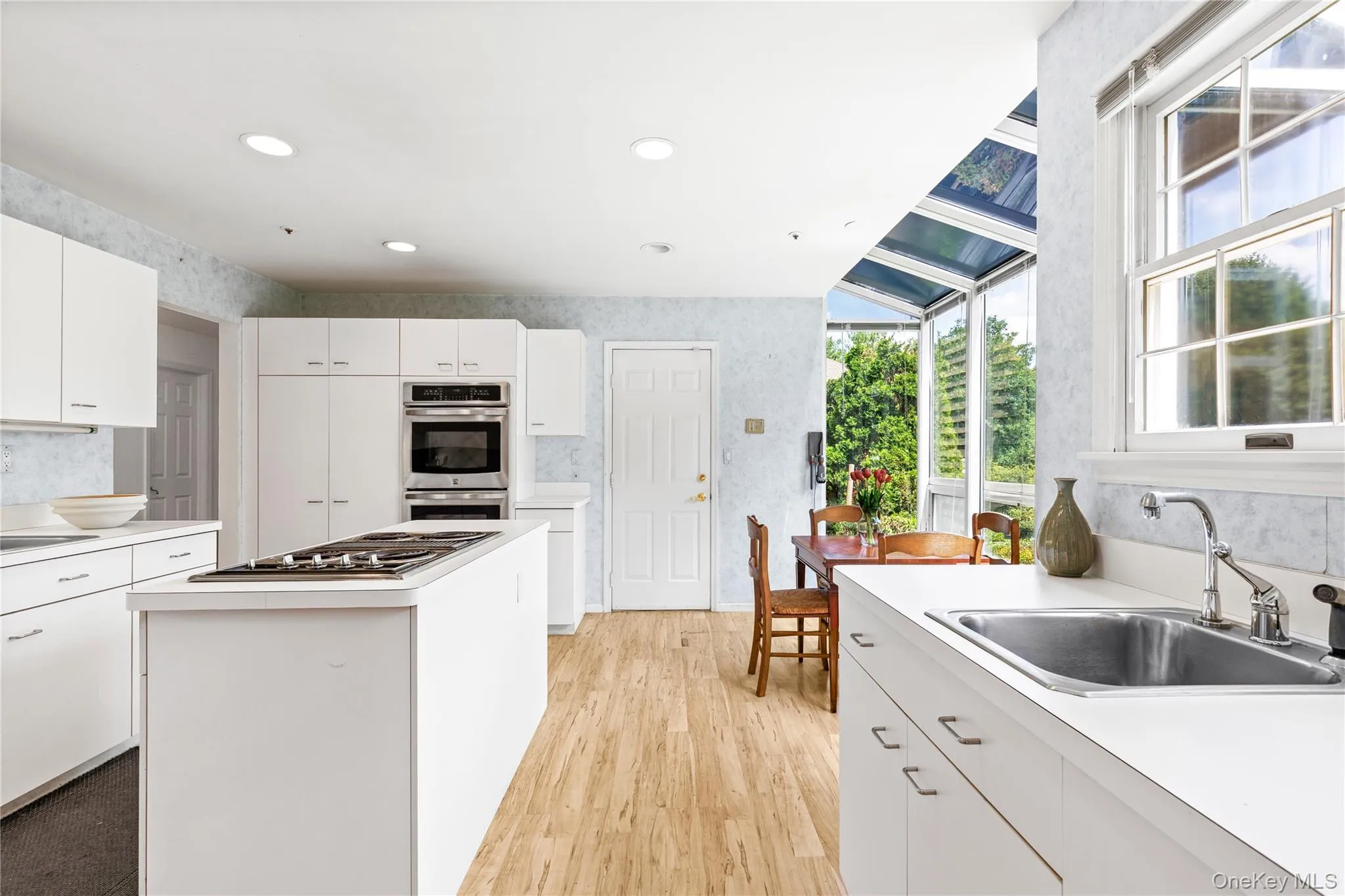 The kitchen is anchored by a center island The kitchen is anchored by a center island