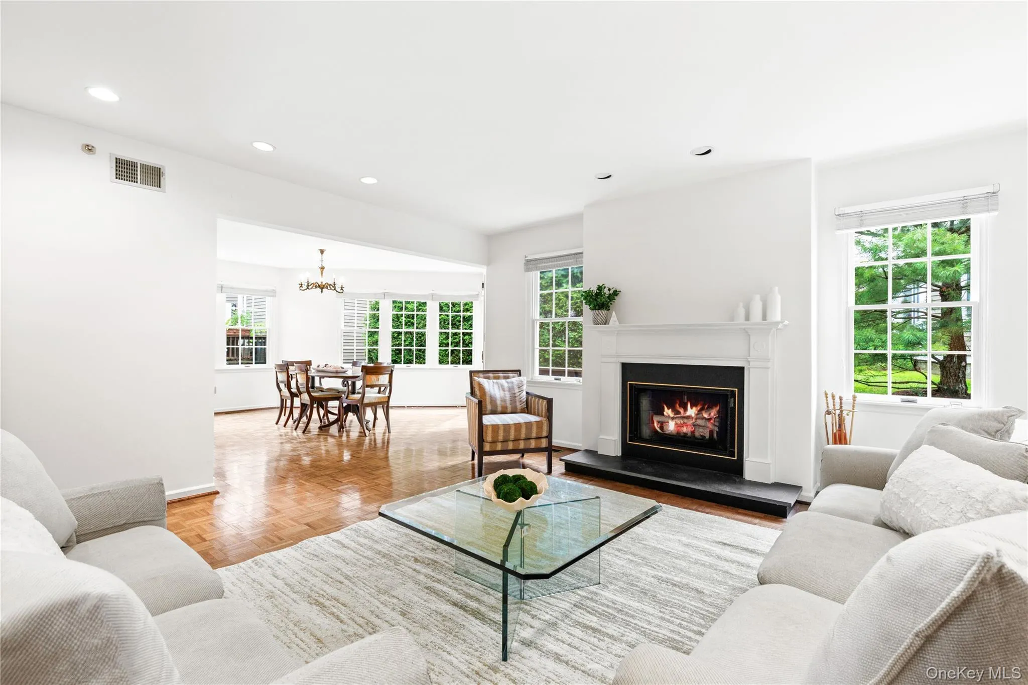 The living room/ dining room space is perfect for entertaining The living room/ dining room space is perfect for entertaining