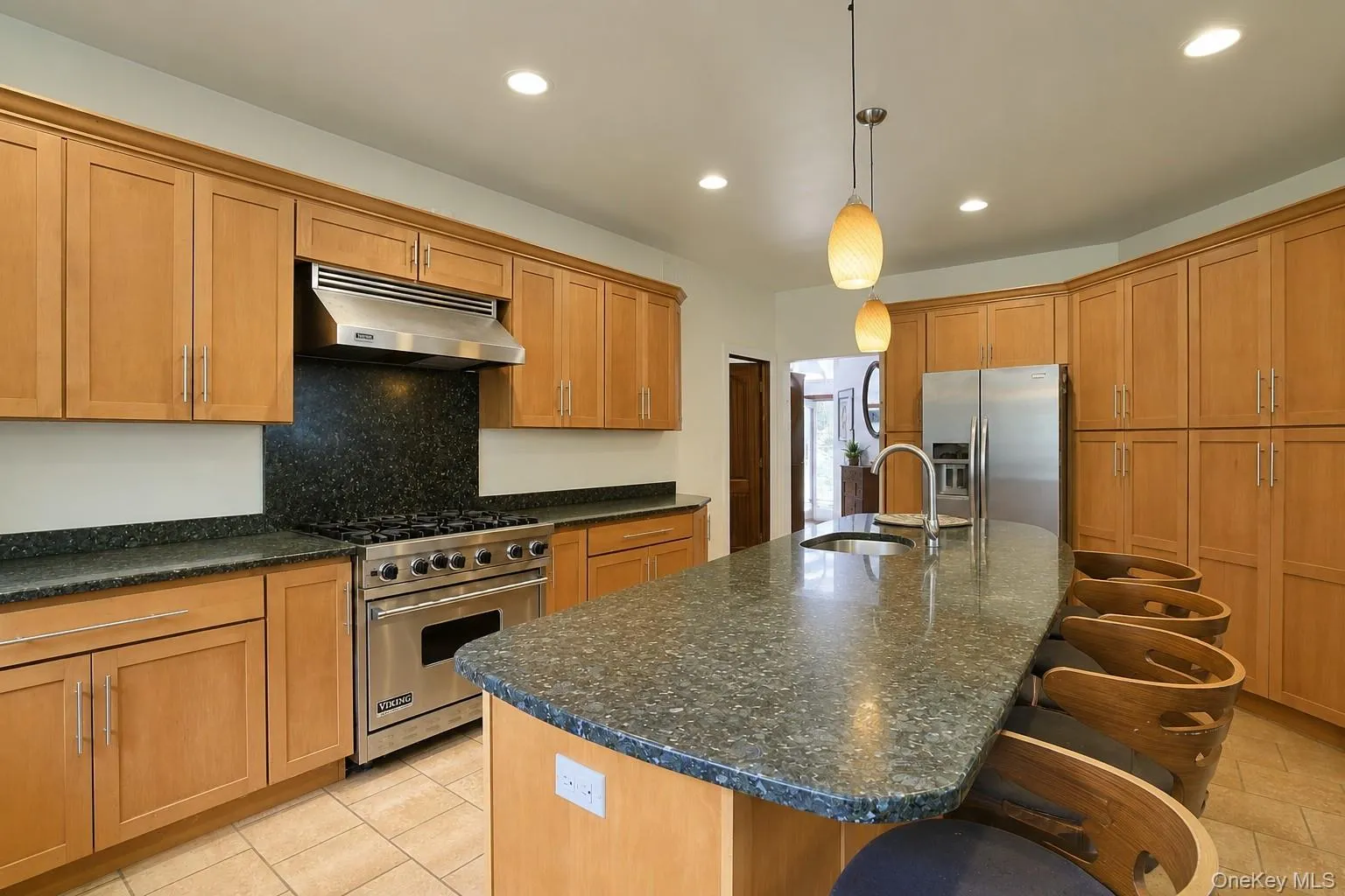 Kitchen with granite counter tops, and custom cabinetry. Kitchen with granite counter tops, and custom cabinetry.