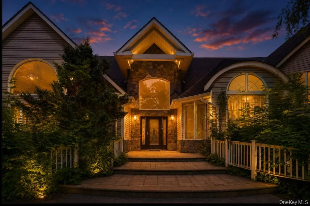 Twilight view of the property. Enhanced by AI. Twilight view of the property. Enhanced by AI.