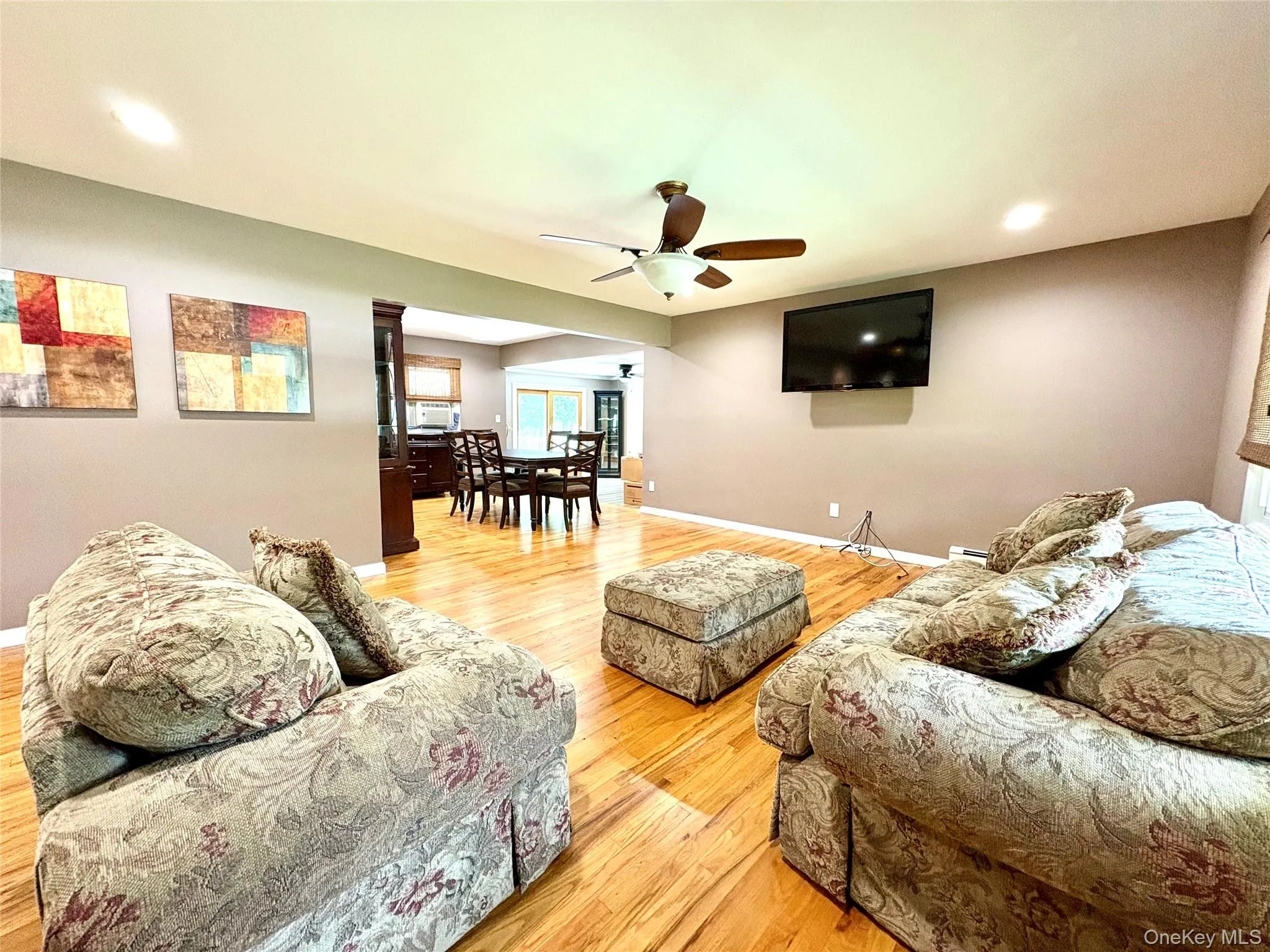 Large living room open to dining room. Large living room open to dining room.