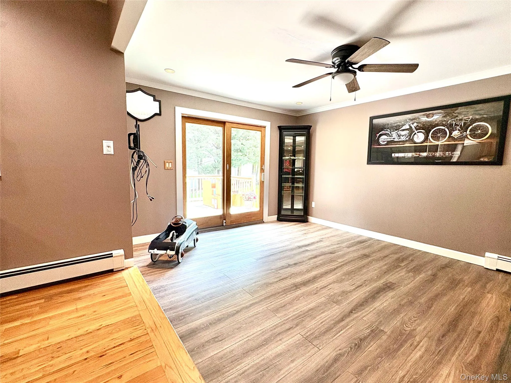 Den with sliders to back deck. Den with sliders to back deck.