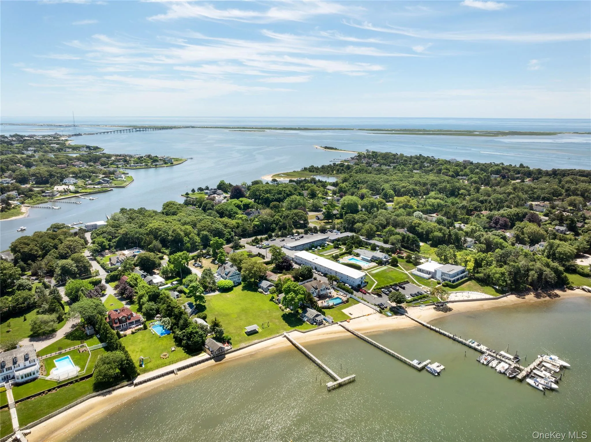 Bird's eye view of a large body of water and a notable bridge Bird's eye view of a large body of water and a notable bridge