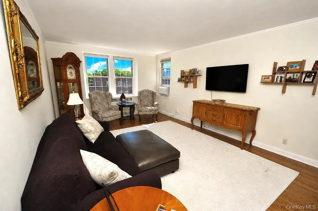 The Oversized Living Room has sunny Southern exposures, gleaming hardwood floors and opens to the entry foyer. The living room is approx 19'-1" x 12'-10. and entry foyer is an approx. additional 12'-10" x 6'-3" The Oversized Living Room has sunny Southern exposures, gleaming hardwood floors and opens to the entry foyer. The living room is approx 19'-1" x 12'-10. and entry foyer is an approx. additional 12'-10" x 6'-3"