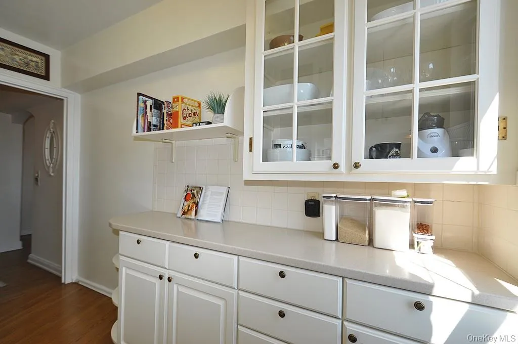 Updated Kitchen has Corian Counters, custom cabinets and a window for natural light and fresh air. Updated Kitchen has Corian Counters, custom cabinets and a window for natural light and fresh air.