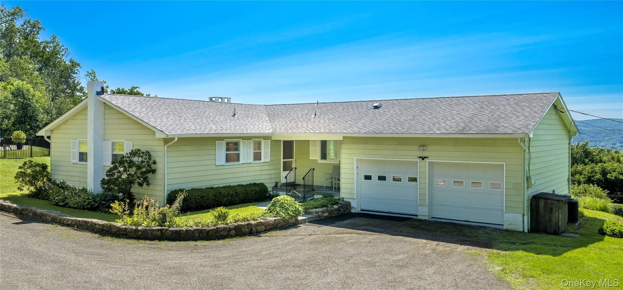 Ranch-style residence featuring two car garage & manicured entrance. Ranch-style residence featuring two car garage & manicured entrance.