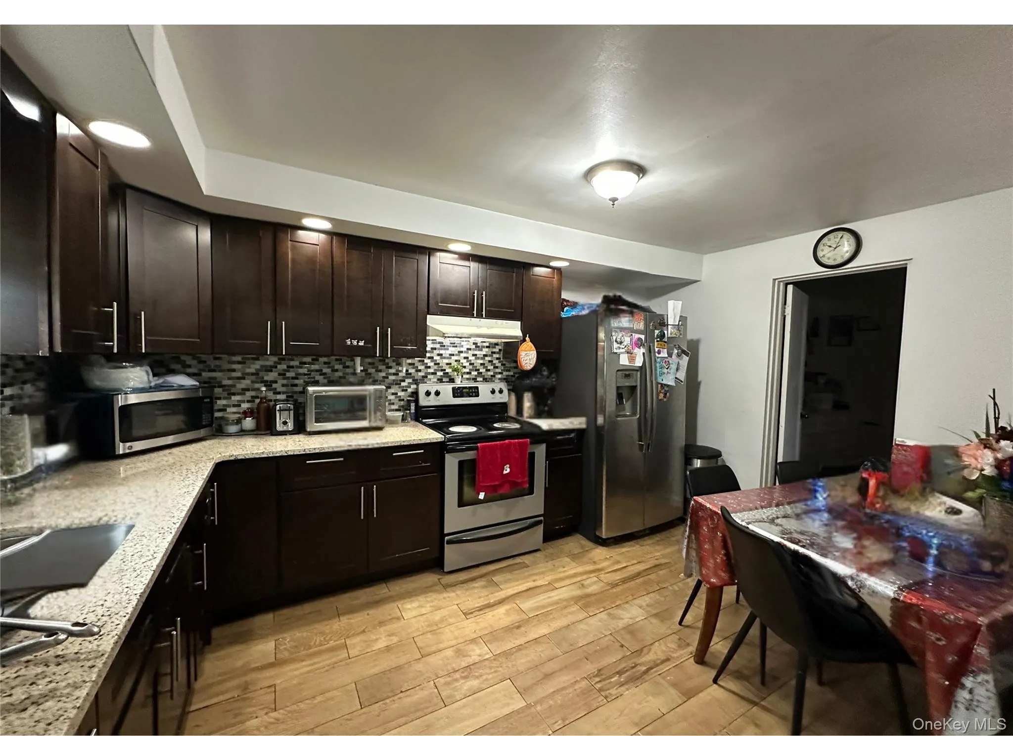 Eat in kitchen with stainless steel appliances Eat in kitchen with stainless steel appliances