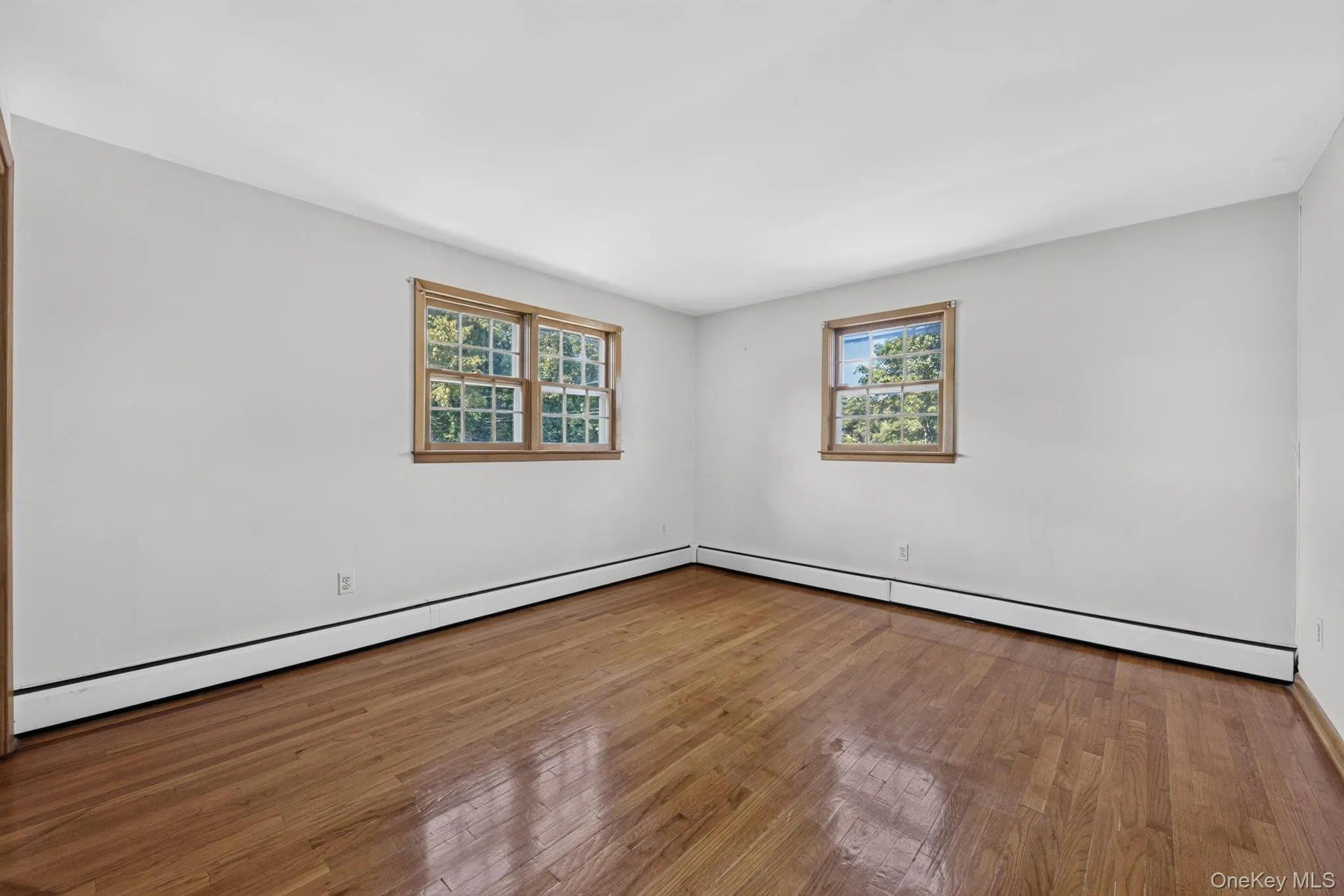 Hardwood flooring extending throughout the room Hardwood flooring extending throughout the room