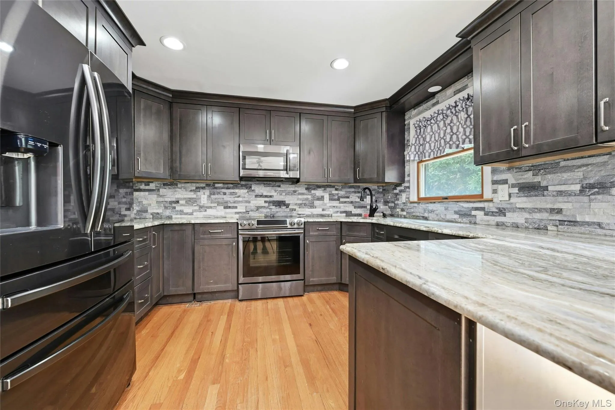 Granite Countertops, Stone Backsplash, SS Appliances, LED Hi Hats Granite Countertops, Stone Backsplash, SS Appliances, LED Hi Hats