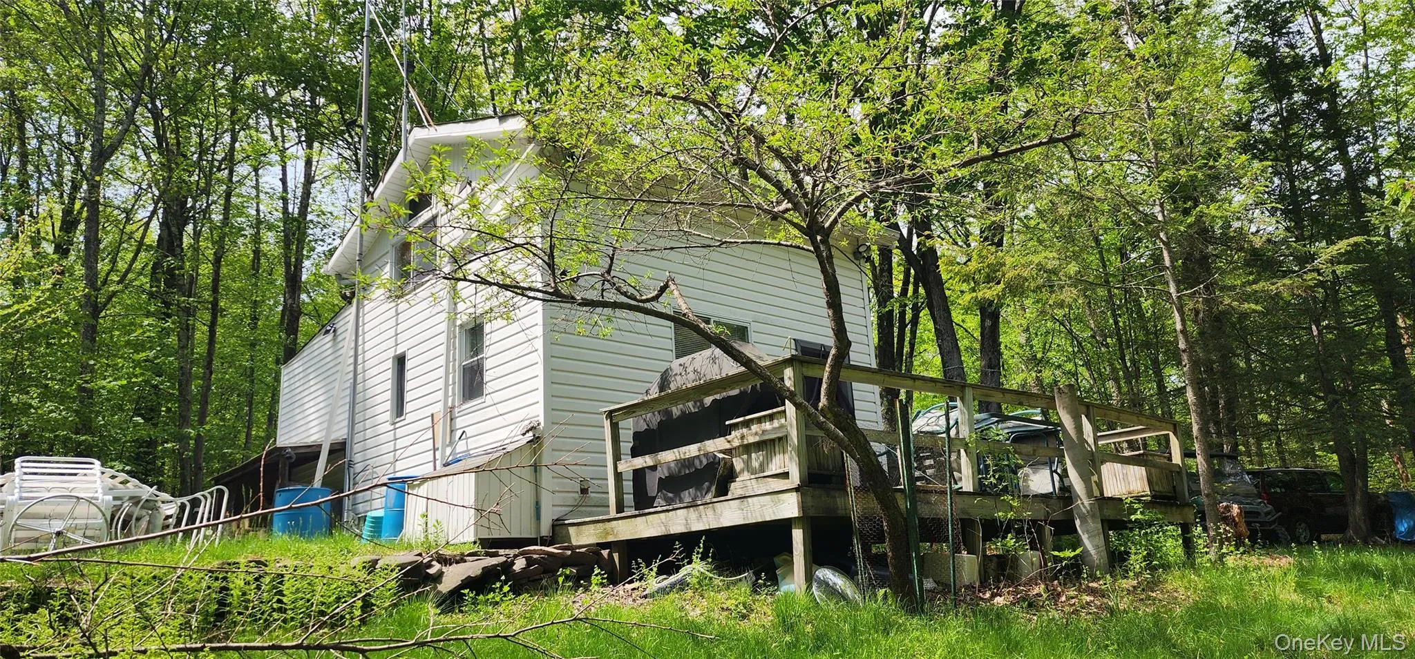 View of side of home featuring a deck View of side of home featuring a deck