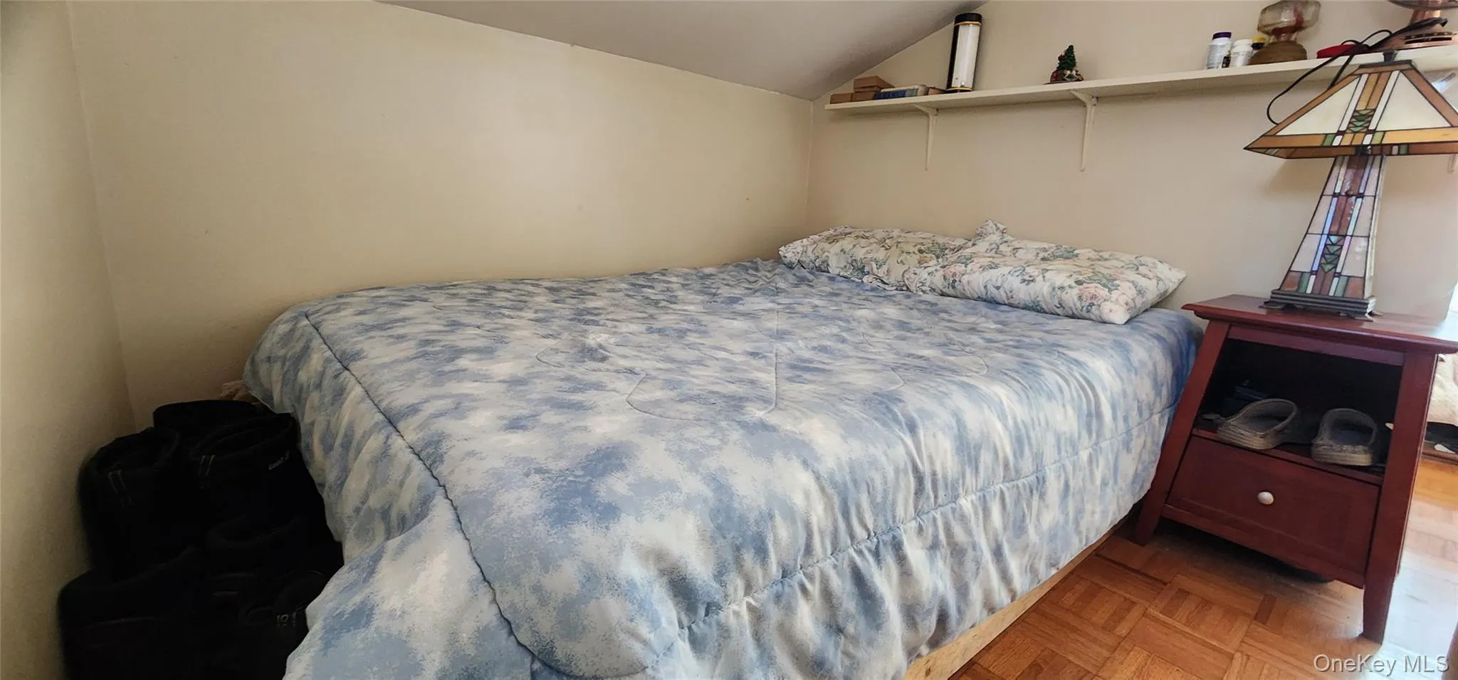 Bedroom with parquet floors and lofted ceiling Bedroom with parquet floors and lofted ceiling