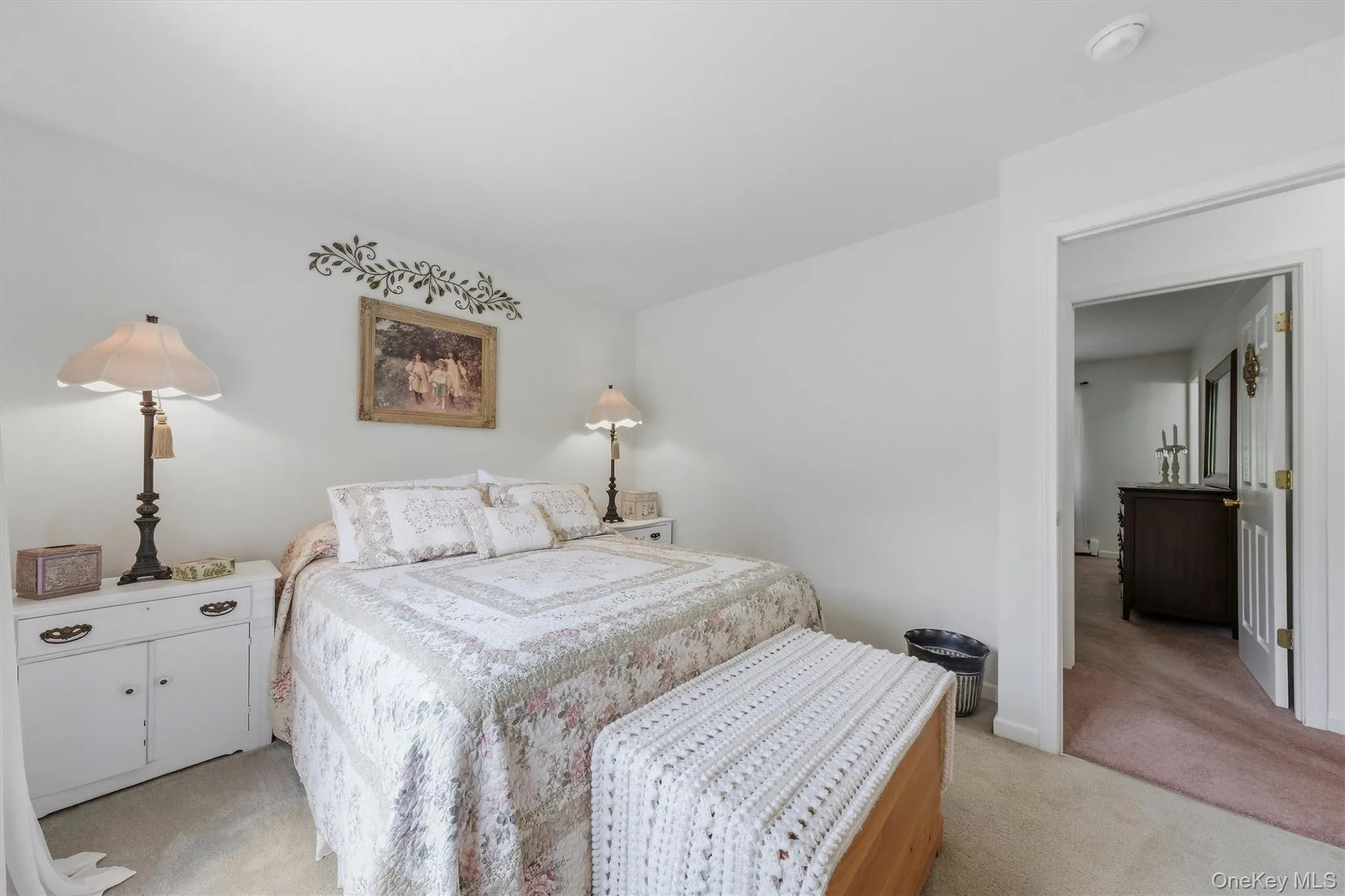 Recessed lighting, wall-to-wall carpeting, and a white interior door frame Recessed lighting, wall-to-wall carpeting, and a white interior door frame
